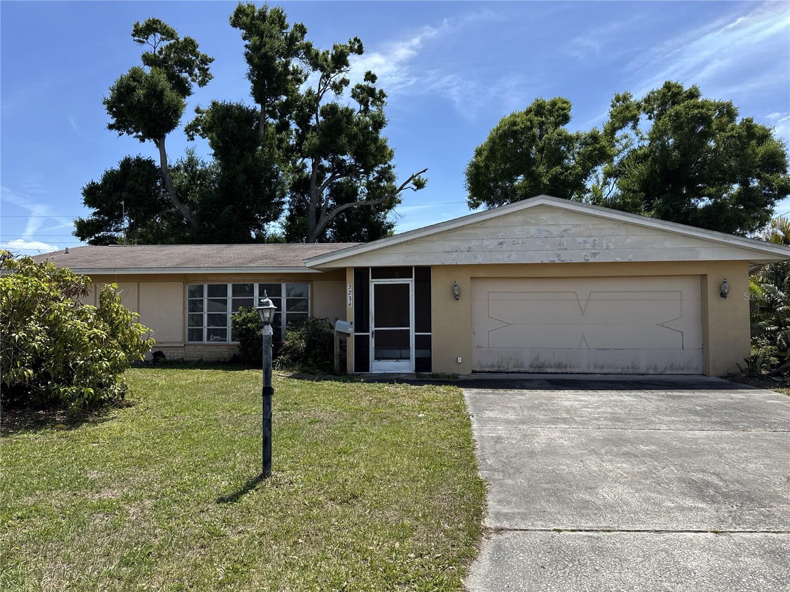 This 3 bedroom,  3 bath home in Sarasota offers a split bedroom floorplan that creates flexibility for various uses. The layout separates the primary suite from the secondary bedrooms, a practical design for occupants seeking privacy or rental potential.   Bedroom 3 includes an efficiency kitchen, providing a living setup ideal for multi-generational households or rental scenarios. The home requires updates and attention, but the bones and spatial layout provide a solid foundation to work from. This is an opportunity to acquire real estate in an established Sarasota location at a price that reflects the current condition.  If you're ready to explore the potential here, schedule a showing today.