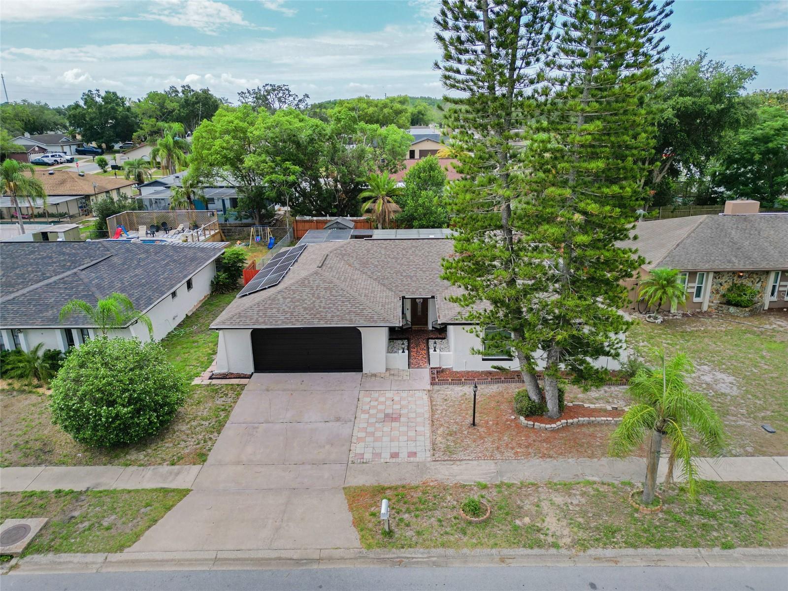 Welcome to this beautifully maintained home in the desirable community! This versatile property features 3 bedrooms, 2 bathrooms, plus an additional flex room that can serve as a private mother-in-law suite, home office, guest room, or playroom.

Step outside and enjoy your own private pool, perfect for relaxing and entertaining year-round. The fully fenced backyard provides privacy and space for family gatherings, pets, and outdoor activities. The home also includes a spacious 2-car garage and offers a functional layout designed for comfortable living.

One of the standout features of this property is the solar panel system, which will be fully paid off at closing, allowing the new owner to enjoy energy savings without any solar loan payments.

Conveniently located near shopping, dining, schools, parks, and major highways, this move-in-ready home combines flexibility, comfort, and value. Don't miss the opportunity to make this exceptional property your new home!
