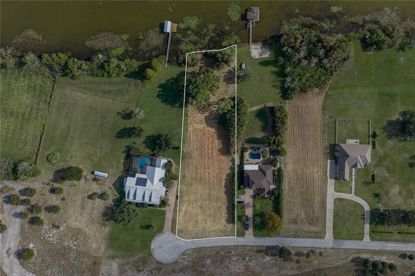 Superb and serene 1.24 acre residential lake lot on Lake Mariana, which spans 507 acres and is less than 2 miles from downtown Auburndale.  

This lot is part of the exclusive Kennwood on the Lake neighborhood, and one of only 10 beautiful residential lots, with home sizes ranging from 3,100 - 4,500 SF.  The neighborhood association also owns a 40 acre Common Area (Conservation Easement), which cannot be developed. This area can be considered common recreation space.  

The HOA Association is self managed at present, and dues are $1,000/year, payable bi-annually.

Auburndale is a growing community within Polk County, FL, located in between Lakeland on the west and Winter Haven on the east.  Being only 30 miles from Disney and 50 miles to Tampa, this location combines the convenience of quieter living while being within an hour of major cities.