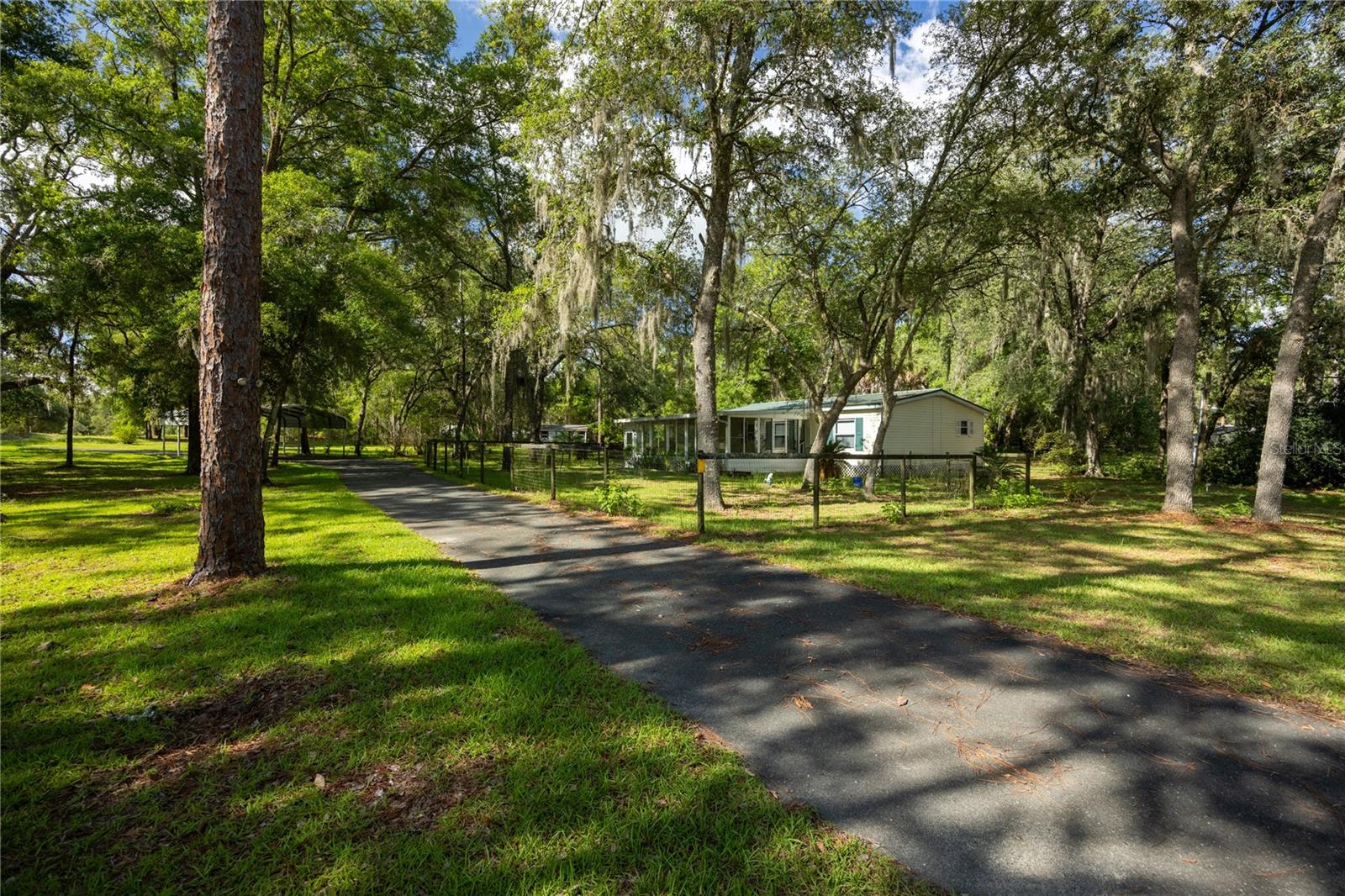 This amazing property features a 1080 square foot 1996 manufactured home situated on 2.5 acres of land, providing a sense of privacy and ample room for a variety of uses, such as gardening, recreational activities, or accommodating animals. The expansive lot enhances the property’s rural character and offers flexibility for future improvements or outdoor projects. The residence includes 2 bedrooms and 2 bathrooms, offering a practical and efficient layout suitable for a small household, seasonal residents, or those seeking a more manageable living space. A notable feature of the property is the spacious 4-car barn/garage, which can serve multiple purposes, including vehicle storage, a workshop, equipment storage, or agricultural use. This structure adds significant functional value, particularly for those with hobbies, trades, or livestock needs. Overall, this property combines the simplicity of manufactured housing with the benefits of a larger parcel of land, making it well-suited for individuals seeking a quiet, rural lifestyle with versatile outdoor space.