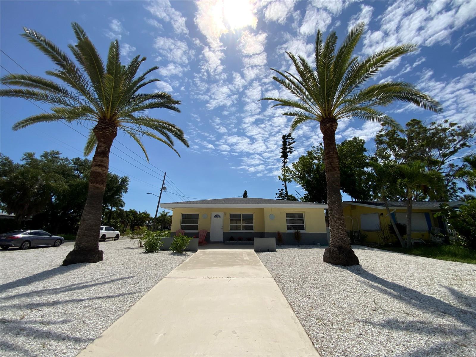 Want to watch the sunset every night from your front porch? Here’s your opportunity to own an affordable, solid-built block home just minutes from all the attractions that make St.Petersburg one of the most desirable locations to live. The home is a 2 bedroom and 1 bathroom which has been recently updated. The Terrazzo flooring has been beautifully refurbished, newly updated bathroom with new tile flooring and bathroom fixtures, the interior and exterior have been beautifully painted, the a.c. unit has been well maintained with 2 additional services left on the contract, and the landscaping has been completely updated with mostly shell with two handsome Sylvester palm trees that sit perfectly in the front of the home. This home is situated on a prime corner lot across the street from a charming waterfront park right on Boca Ciega Bay. The larger corner lot has room for extra parking for a boat, RV and room for a pool to be added. It’s in the heart of South Pasadena, just a few blocks from the Palms of Pasadena Hospital, the local fire station, and major grocery stores. Many residents enjoy walking and riding their bikes just over the Corey Causeway Bridge which leads to St. Pete Beach and Treasure Island. Condé Nast Traveler has named St. Pete Beach as one of the nicest beaches to visit in the U.S. St. Petersburg has a vibrant downtown and waterfront, with great museums, restaurants, shops, and entertainment. Plus, Tampa International and Clearwater International airports are both within a 30 minutes’ drive. Whether you're looking for a primary residence or an investment opportunity, this home places you in the center of one of Florida’s best small towns and beach locations. Call me for your own private showing.