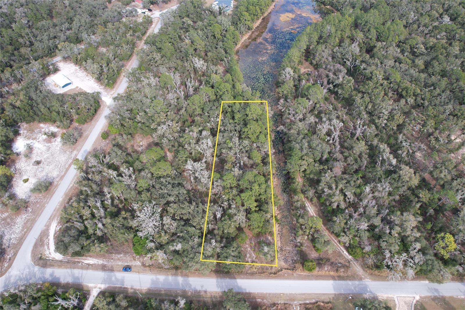 Country Living at it's finest. Come build your dream home on this small lake. Two connecting lots available.
