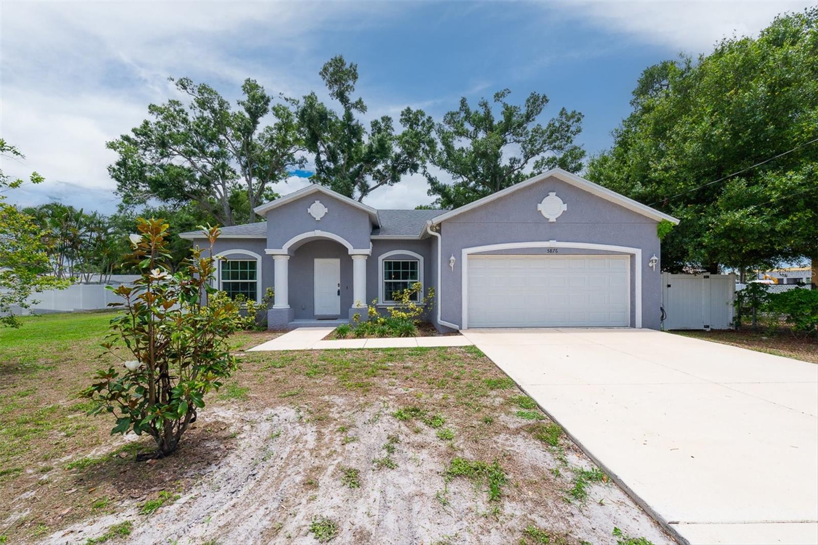 Immaculate 2020-Built Home in Pinellas Park – Solar Included & Paid Off at Closing! Why wait to build when this stunning 2020-built gem is move-in ready and loaded with upgrades? This 3-bedroom, 2-bath split floor plan home with a 2-car garage offers the perfect blend of modern design, energy efficiency, and everyday comfort. Step inside to a bright and airy open-concept layout where natural light pours through double-paned, insulated Energy Star® windows. Soaring 9'4" volume ceilings create an expansive feel, while gorgeous stone countertops and Frigidaire Gallery® Smudge-Proof™ stainless-steel appliances make the kitchen a true showpiece. The spacious master suite is a private retreat, complete with a generous master bath designed for relaxation. The split floor plan ensures privacy for family and guests alike. Energy-conscious buyers will love the solar panels, fully paid off at closing, along with the high-efficiency Energy Star® heat pump, 40-gallon quick recovery water heater, and Scott Eco-Care® low-VOC paints throughout. Custom hurricane shutters provide peace of mind during storm season, while the Timberline Prestige® HD roofline shingles. Tech-forward features include RG-6 Quad cable data wiring with surge protection and convenient USB ports throughout the home. This is Florida living at its finest! Energy-efficient, hurricane-ready, and beautifully appointed.