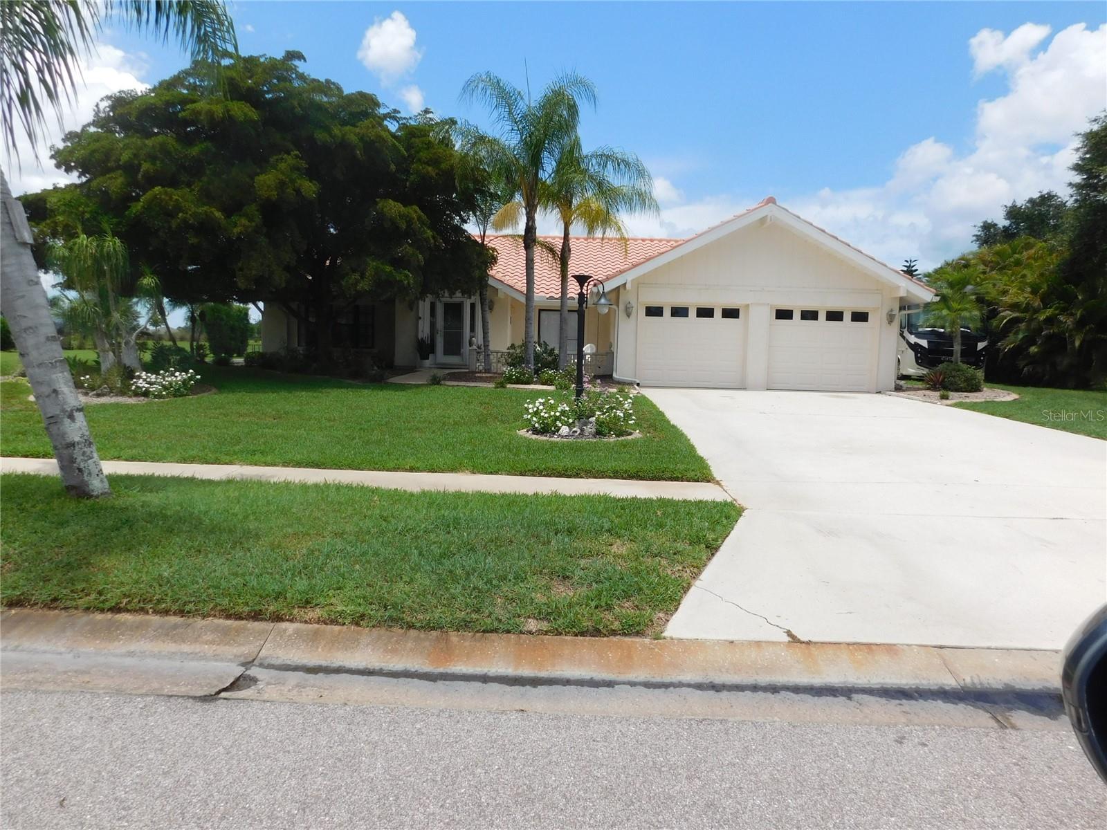 Lovely, unique 3-bedroom 2 bath pool home. Inside you have a spacious living area a kitchen with stainless appliances, granite counters, large owner's suite with walk in closet and large bathroom. New A/C in 2022 and electrical panel new in 2023. Outside you can enjoy the Florida lifestyle with an expansive covered Lanai, large pool and mature landscaping plus your own shuffleboard court. Great area for entertaining. RV parking with water and electric hookups. All this just minutes from Cocoplum Plaza for shopping, restaurants and interstate 75 for travel. . No HOA or CDD fees. Move in ready and priced to sell!