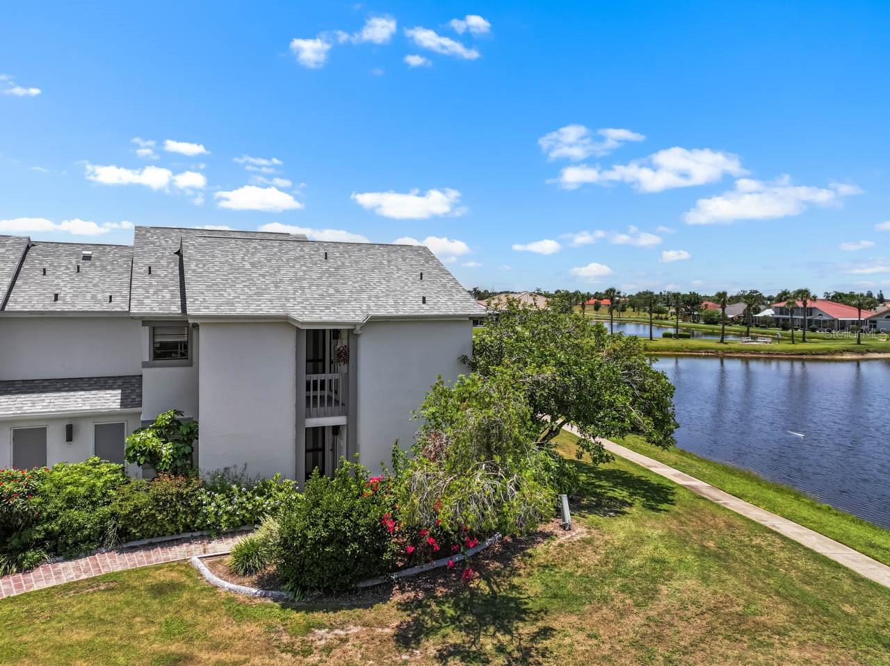 Welcome to this beautifully updated, second-floor condo located at 609 Lively Dr, Unit B, in the heart of Sun City Center’s premier 55+ community. Offering an elevated perspective and wonderful privacy, this immaculate home boasts a serene, picturesque pond view right from your living space, creating a peaceful backdrop for enjoying your morning coffee or unwinding at sunset. Step inside to discover a bright, sun-drenched open floor plan showcasing high-end, contemporary updates throughout. The gorgeous, fully modernized kitchen serves as a true focal point, beautifully appointed with sleek quartz countertops, refreshed cabinetry, and ample prep space. The upscale design flows seamlessly into the bathrooms, which have both been thoughtfully refreshed with elegant granite-topped vanities and modern fixtures. With maintenance-free living handled, you can spend your days fully enjoying the world-class, resort-style lifestyle of Sun City Center. This vibrant, golf-cart-friendly community features sparkling heated pools, a state-of-the-art fitness center, tennis and pickleball courts, and over 150 active social clubs. Whether you are looking for a turnkey year-round retreat or a hassle-free winter escape, this absolute gem is ready for you to move right in. Thie ONLY thing that is missing is YOU!