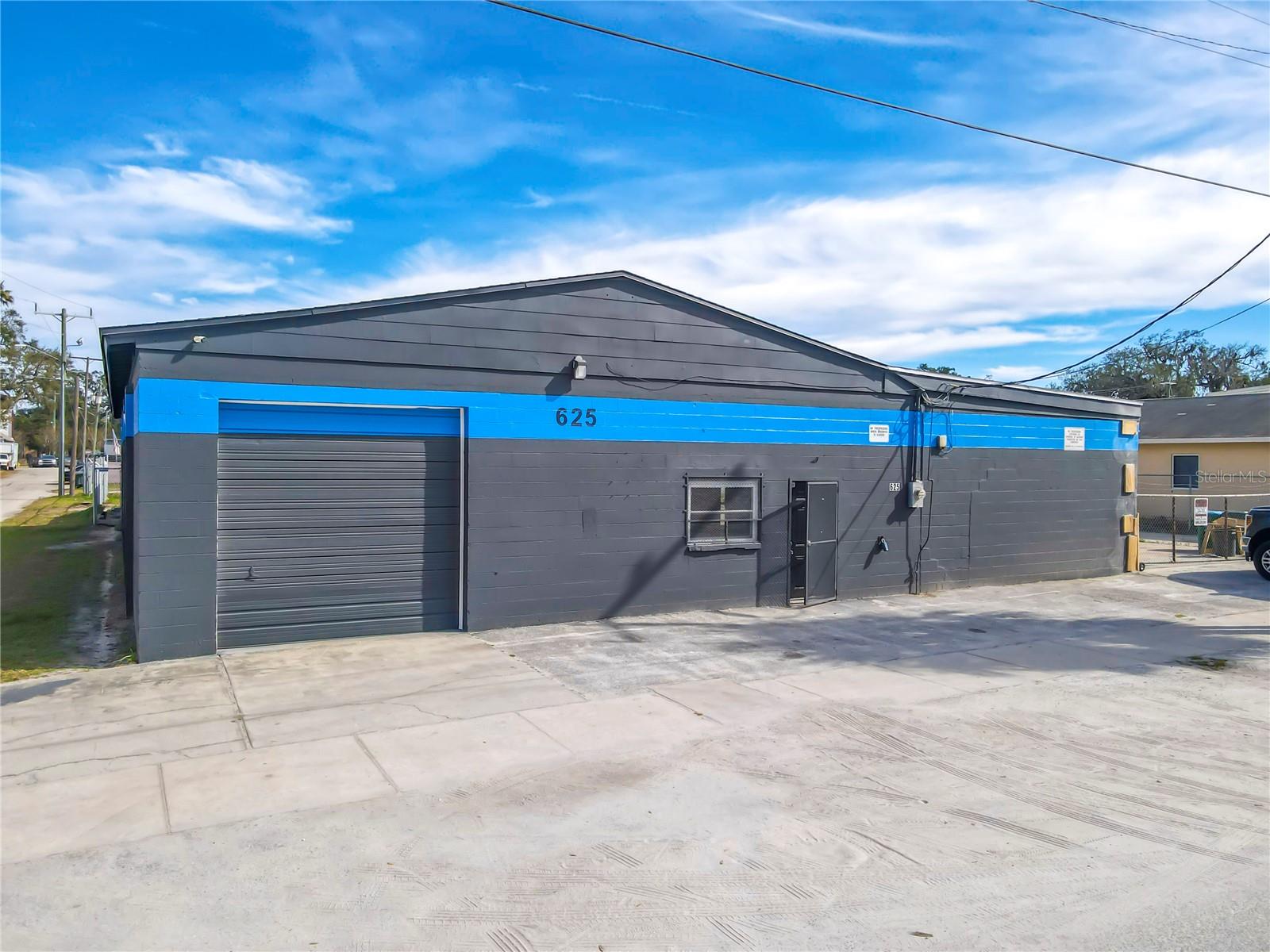 This Industrial/Commercial building is located nearby US1 on a large, fenced corner lot. Leasable space includes the 3,000SF main building along with 1,900SF canopy area. Building features 4 garage roll-up doors, a vehicle lift, lobby and office space. Restrooms are located outside by canopy area. Perfect for an Auto Shop or any other Warehouse or Industrial use. An additional 1,800SF building with electrical is also available.
Trailer onsite is being occupied with Grounds Keeper until Leased.
