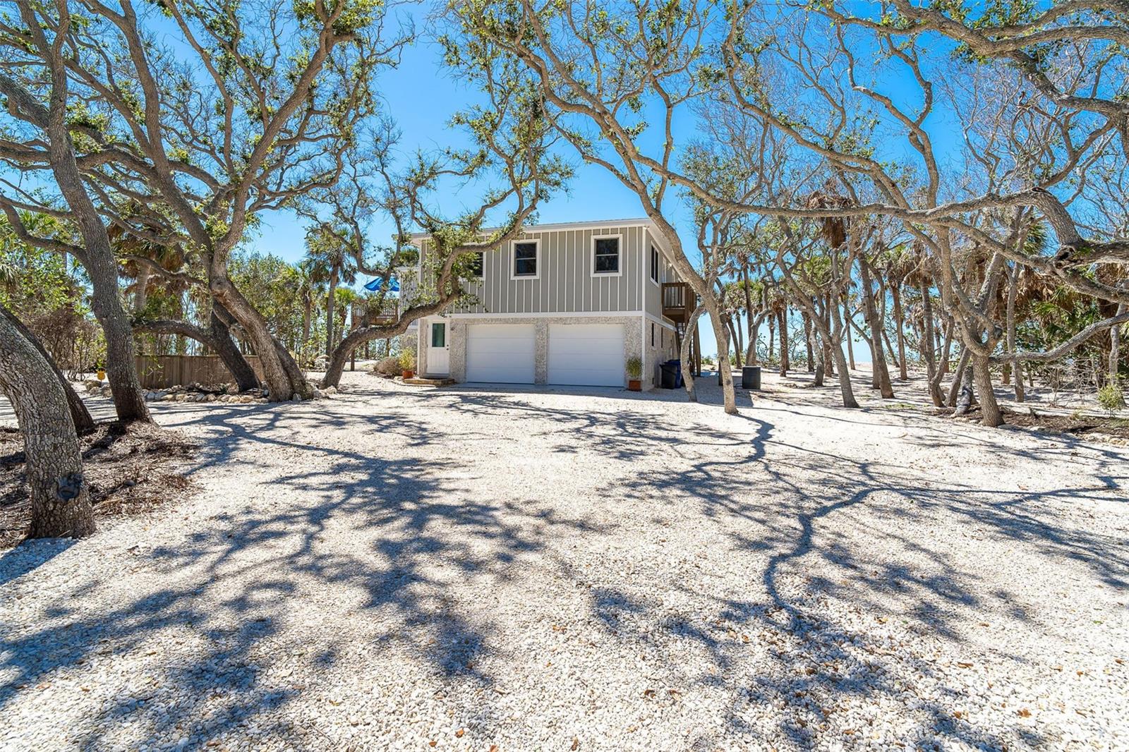 Welcome to 6430 Manasota Key located in Englewood on southwest Florida's 11 mile Island where you will enjoy & experience the unhurried pace of life with Old Florida ambiance.  With 3,013 of living area, the home sits on 1.219 acres. Stretching 150 feet of Gulf frontage. Deeded shared boat docks is included with this property located directly across the street.

FIRST FLOOR: Mother-in-law suite features;  two bedrooms & two baths with an open kitchen and living room, including private entrance, this makes for the perfect accommodations for Family or Guests.
SECOND FLOOR : features two bedrooms, two baths, open kitchen with combination dining room & Living room with wood burning fireplace.  Enjoy entertaining from the wrap around deck while showcasing stunning views of the Gulf of Mexico. Hurricane Anderson impact windows and doors through out for peace of mind. There is an outside potting shed that can be used for storing beach toys, kayaks and paddle boards. Stroll the sandy beach for shark's teeth & seashells and watch the dolphins dance along the water edge & tortoise turtles lay their eggs.
 Paradise awaits you in this truly amazing beach home where memories are made.