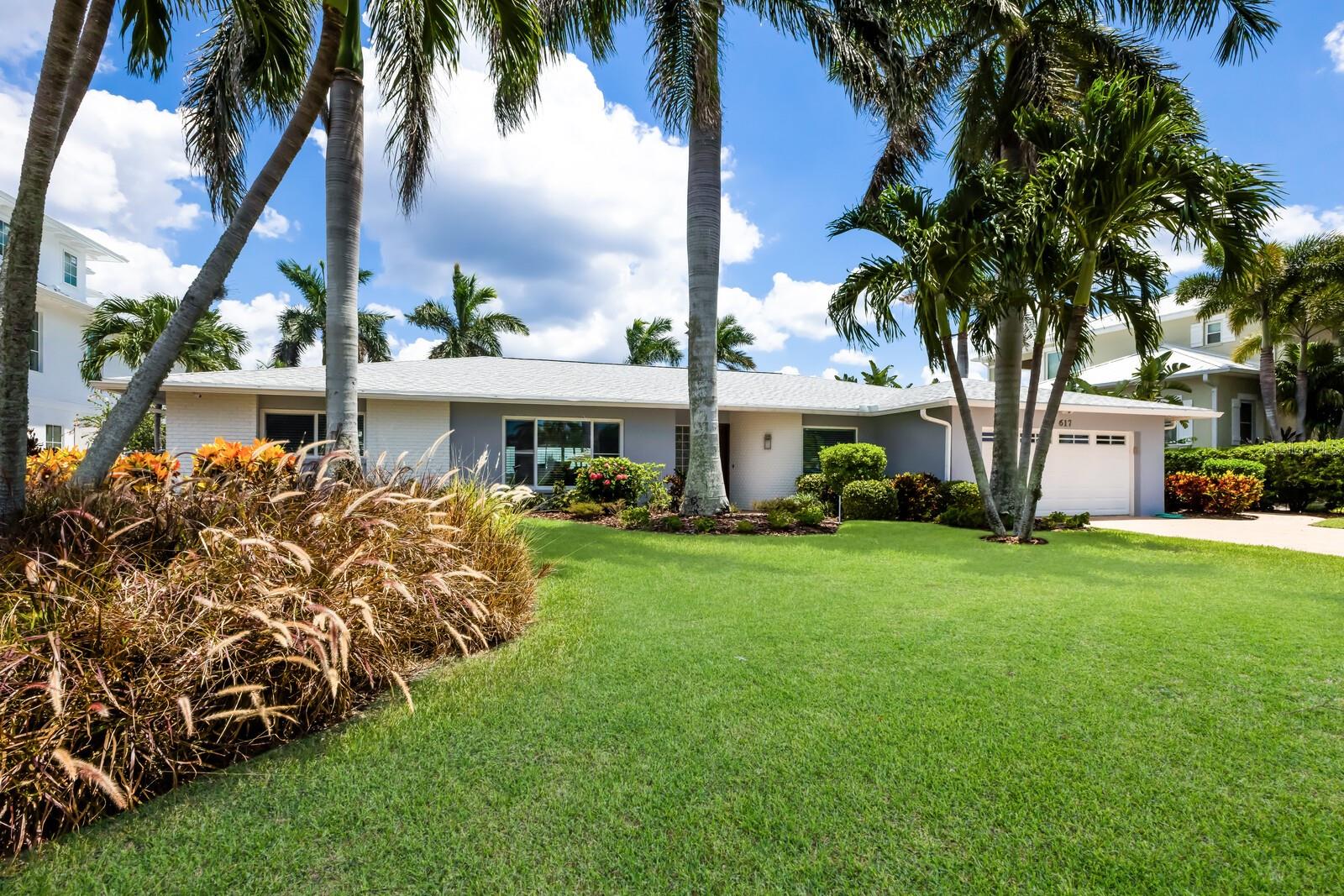 This exceptional waterfront home offers an unparalleled blend of luxury, comfort, and location in the prestigious Key Royale neighborhood. This property features 3 bedrooms, 2 bathrooms, and a spacious 2-car garage. The open floor plan, highlighted by vaulted ceilings, creates a seamless flow between the kitchen and great room, making it ideal for both entertaining and everyday living. The master bedroom includes a built-in office, providing a private and functional space.
Set on an oversized 14,720 sq ft lot with 90 feet of direct intercoastal waterfront, this home is a boater’s paradise, complete with an 11,000 lb boat lift and direct intercoastal access. The breathtaking views of the Sunshine Skyway and the sunrise are a daily delight. Outdoors, the property offers a private retreat with a pool, heated gas spa, gas fire pit, and a dedicated gas line for an outdoor grill, perfect for enjoying Florida’s year-round sunshine.
Safety and comfort are top priorities, with newer roof and air conditioning system, along with impact-resistant windows and doors. The home is being sold furnished, making it move-in ready for the next owner. Additionally, the Key Royale neighborhood offers a private 9-hole executive golf club with options for social or golf memberships, and an exclusive clubhouse and restaurant available only to members. A short golf cart ride brings you to the beautiful white sand Gulf beaches, adding to the appeal of this stunning location.
This residence has been a cherished second home for the current owners, serving as a special gathering place for family and friends, where countless cherished memories have been made. From holiday celebrations to summer retreats, this home has provided a warm and welcoming backdrop for life’s most important moments.
