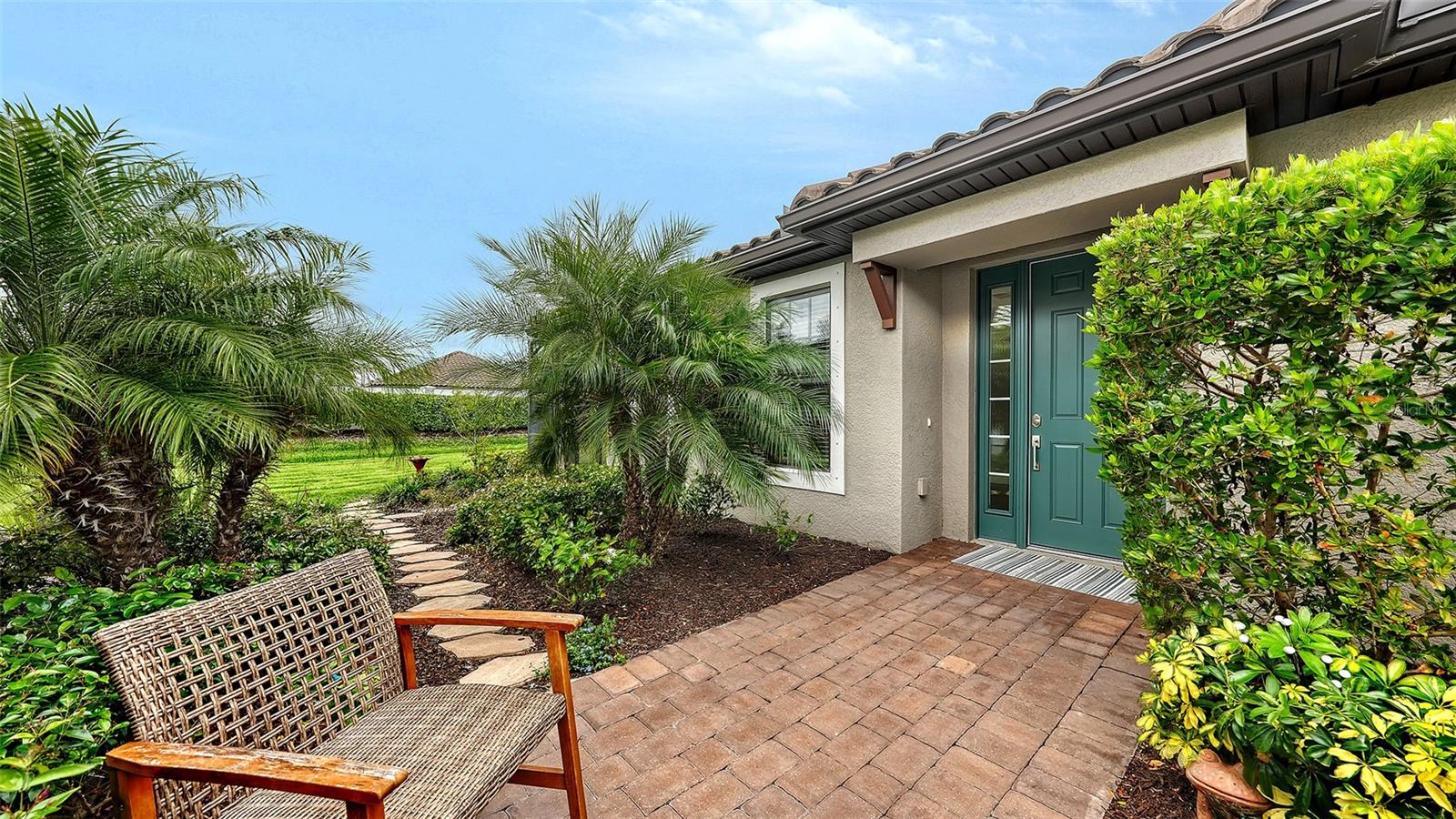 Avoid the noise, dust and workman and move in immediately to  this meticulously maintained, gently lived-in home.  This home includes a washer, dryer, refrigerator, hurricane shutters, and smart home features for added comfort and peace of mind.  Seller upgraded this home adding luxury vinyl in the bedrooms—no carpet for easy maintenance and a modern feel. Additional upgrades include a scrub sink in the laundry room and overhead storage racks in the garage.  Step into effortless Florida living with this beautifully designed single-family home offering 2 bedrooms, 2 bathrooms, a dedicated dining room, and a versatile flex space—perfect for a home office, hobby room, or guest area. 
The stylish kitchen is a true showstopper with gorgeous quartz countertops, fashionable silver-gray cabinetry, gas cooking and specialty lighting that adds a designer touch. Recessed lighting throughout the home creates a bright and inviting atmosphere, while the interior laundry room with utility sink adds everyday convenience. 
Enjoy your morning coffee or unwind in the evening on the screened lanai overlooking a private, maintenance-free yard—professionally cared for by the Association so you can spend more time enjoying life.
Beyond your doorstep, experience unmatched amenities in a vibrant, resort-style community. “The Hub” offers state-of-the-art techno gym equipment along with a variety of classes including strength training, yoga flow, mat pilates, and guided meditation. Grab your favorite coffee or latte at the on-site café, browse boutique-style retail, or relax poolside at the resort pool with cabanas. Stay active with pickleball, tennis, and bocce courts, or explore nature-rich paths and trails. Social spaces abound with fireside seating, an entertainment lawn, putting green, corn hole, and even a bark park for your furry friends.
This is more than a home—it’s luxury resort-style living right in your own backyard.