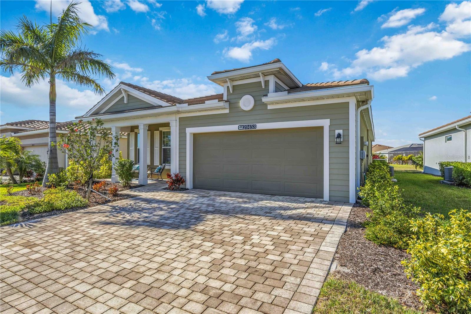 Oversized heated saltwater pool. Extended screened lanai with waterfall feature. Tranquil lake views and unforgettable sunset backdrops. Perfectly positioned in the heart of Wellen Park, this beautifully maintained residence delivers the ultimate private backyard retreat — where glowing sunsets reflect across the water and every evening feels like a resort getaway.

Designed for both function and flexibility, the home offers a true three-bedroom layout plus a versatile flex space ideal for a home office, den, or hobby room. Plank tile flooring flows seamlessly throughout the main living areas, blending durability with modern style, while the open-concept design creates an effortless space for everyday living and entertaining.

Thoughtful upgrades enhance both comfort and peace of mind, including an epoxy-coated garage floor, widened driveway, plug-and-play whole-home generator hookup, whole-house surge protection, and a soft-start AC system. Updated pool cage lighting and enhanced landscaping elevate the lush, private ambiance.

Located in a completed, finished neighborhood — no ongoing heavy construction — residents enjoy the benefits of a well-established community with an on-site activities director, robust amenities, and a vibrant social calendar. Even better, the home features low HOA and low CDD fees, offering exceptional value within one of Southwest Florida’s most desirable master-planned communities.

Just minutes from dining, shopping, recreation, and the lively downtown district of Wellen Park, this home combines lakefront serenity with everyday convenience.

Lake views. Resort-style pool. Modern upgrades. Low fees. Finished community living — this is Florida at its finest.