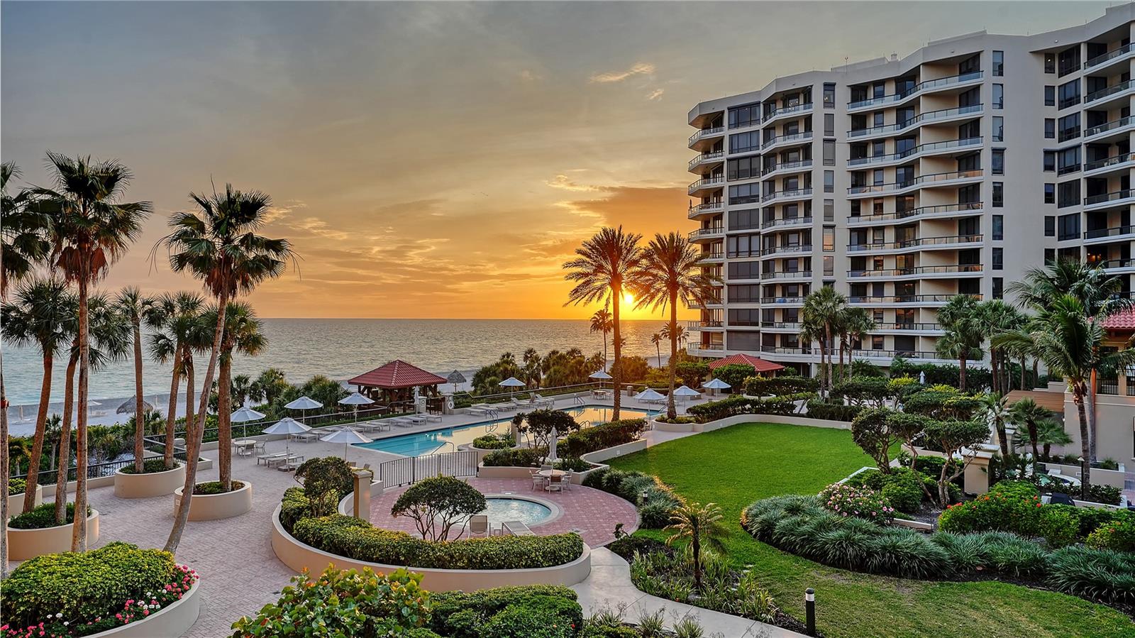 Framed by sweeping Gulf sunset views and the manicured grounds of the Water Club, this expansive third-floor residence in the South Building offers more than 3,000 square feet of refined coastal living. Designed with both privacy and comfort in mind, the residence pairs a thoughtfully updated interior with immediate access to one of Longboat Key’s most sought-after resort-style communities.
The true three-bedroom layout was enhanced in 2022 with the enclosure of the den and addition of a closet, creating a more functional and private floor plan. Hardwood flooring flows throughout the main living areas, while all three bathrooms were recently updated in 2024, adding a fresh, modern feel.
The open living and dining areas are designed to capture Gulf and sunset views, complemented by built-ins and a wet bar that enhance both everyday living and entertaining. Floor-to-ceiling glass doors open from the great room, kitchen, and primary suite to two Gulf-facing terraces, creating a seamless connection to the outdoors. 
The eat-in kitchen is both functional and inviting, featuring custom cabinetry, Miele stainless steel appliances, a center island, and a dining nook surrounded by glass to maximize water views.
The primary suite offers a private retreat with its own sitting area, an oversized walk-in closet, and dual en-suite bathrooms designed for comfort and convenience. Two guest bedrooms are thoughtfully arranged in a split plan, including one en-suite, ensuring privacy for family and visitors.
Additional features include covered parking, a private storage unit, and a beverage locker (assigned).
The Water Club is known for its full service, resort-style living, offering a Junior Olympic-size pool, children’s pool, three spas, four Har-Tru tennis courts, and a Mediterranean-inspired clubhouse with fitness center, steam and sauna, library, social spaces, and everyday on-site concierge services. A 24-hour staffed gate provides both privacy and security, while direct access to the Gulf’s sandy beaches completes the experience. 
Located on the south end of Longboat Key, this residence is just minutes from the Longboat Key Club, St. Armands Circle, and downtown Sarasota’s cultural venues, including The Ringling Museum, Van Wezel Performing Arts Hall, Selby Gardens, and waterfront parks—offering a lifestyle that blends coastal beauty with everyday convenience.
