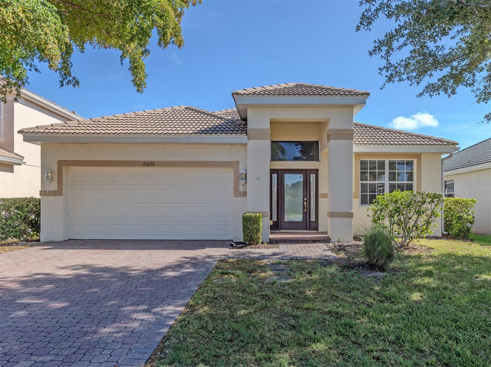 Bring your vision and unlock the potential of this spacious 3-bedroom, 2-bath, lakefront home in the highly sought-after gated community of Stoneybrook at Venice! Whether you're an investor or a buyer looking to personalize a home to your own style, this property presents an exceptional opportunity in one of Venice's most amenity-rich communities.
Designed for comfortable living and entertaining, the thoughtfully planned floor plan features two distinct living spaces. A spacious living room welcomes you at the front of the home, while the open-concept family room, kitchen, and dining area are perfectly positioned at the rear to capture tranquil lake views. The kitchen is thoughtfully designed with abundant cabinetry, a spacious pantry, and a built-in planning center—ideal for working from home, meal planning, homework, or keeping everyday life organized. A generous amount of windows, stationary glass panels, and sliding glass doors fill the home with natural light, creating a bright and inviting atmosphere while showcasing the beautiful waterfront setting. The family room opens to the oversized screened lanai through sliding glass doors, while an additional set of sliders in the flexible space off the primary suite provides seamless access to the outdoors.
The expansive primary suite offers a unique bonus room that can easily serve as a home office, nursery, fitness room, craft room, reading retreat, or sitting area. The oversized walk-in closet provides abundant storage, while the ensuite bathroom features dual vanities, a relaxing garden tub, separate walk-in shower, and private water closet. Two additional bedrooms and a guest bath are thoughtfully positioned to provide privacy for family and visitors.
Step outside to the oversized screened lanai, where you'll enjoy peaceful lake views and plenty of space for outdoor dining, entertaining, or simply relaxing while taking in Florida's beautiful scenery. Hurricane shutters provide added peace of mind and make storm preparation a breeze.
While the home is ready for cosmetic updates, its spacious layout, abundant natural light, desirable waterfront setting, and exceptional floor plan make it an incredible opportunity to add value and create your dream home.
Residents of Stoneybrook at Venice enjoy low HOA fees and an impressive collection of resort-style amenities, including a state-of-the-art fitness center, resort-style pool and spa, clubhouse, pickleball, tennis, basketball, sand volleyball, inline skating rink, playground, walking trails, and a vibrant calendar of community activities.
Conveniently located just minutes from historic downtown Venice, Gulf beaches, shopping, dining, Wellen Park, and I-75, this is your opportunity to create your own vision in one of Venice's most desirable gated communities. With great bones, an outstanding location, and endless potential, this home is ready for its next chapter.