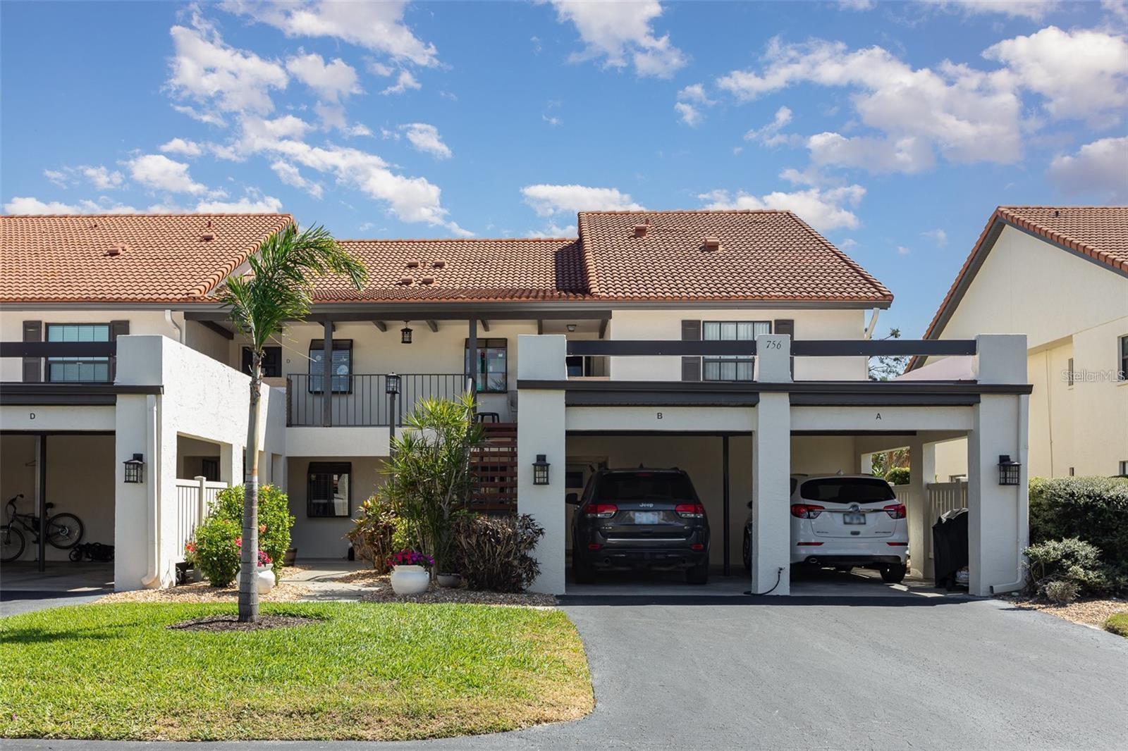 Enjoy spectacular golf course views from this centrally located condo in Estancias of Capri Isles. This 1,186 sq. ft., turnkey-furnished, 2-bedroom, 2-bathroom residence offers an open and inviting floor plan with spacious bedrooms, including a private primary suite with an ensuite bathroom.

The light-filled living and dining area features a convenient pass-through to the kitchen, perfect for entertaining. Both the living room and primary bedroom overlook the Capri Isles Golf Course, framed by majestic oak trees. The primary bedroom also includes a large walk-in closet and sliding glass doors leading directly to the lanai with serene golf views.

Additional features include a one-car carport with driveway space just steps from the front door, impact windows, hurricane shutters for the lanai, a new A/C, new water heater, and a new roof—including a new roof on the carport—for added peace of mind.

Residents of Estancias of Capri Isles enjoy excellent community amenities such as a pool, clubhouse, and beautifully maintained walking paths. The HOA covers cable, internet, and lawn maintenance, offering a truly low-maintenance lifestyle. Ideally located near shopping, dining, grocery stores, and local attractions, with downtown Venice and Venice Beach just minutes away. Easy access to major highways makes travel convenient.

This move-in-ready condo offers the perfect blend of comfort, convenience, and community living. Schedule your private tour today and start enjoying the Florida lifestyle!