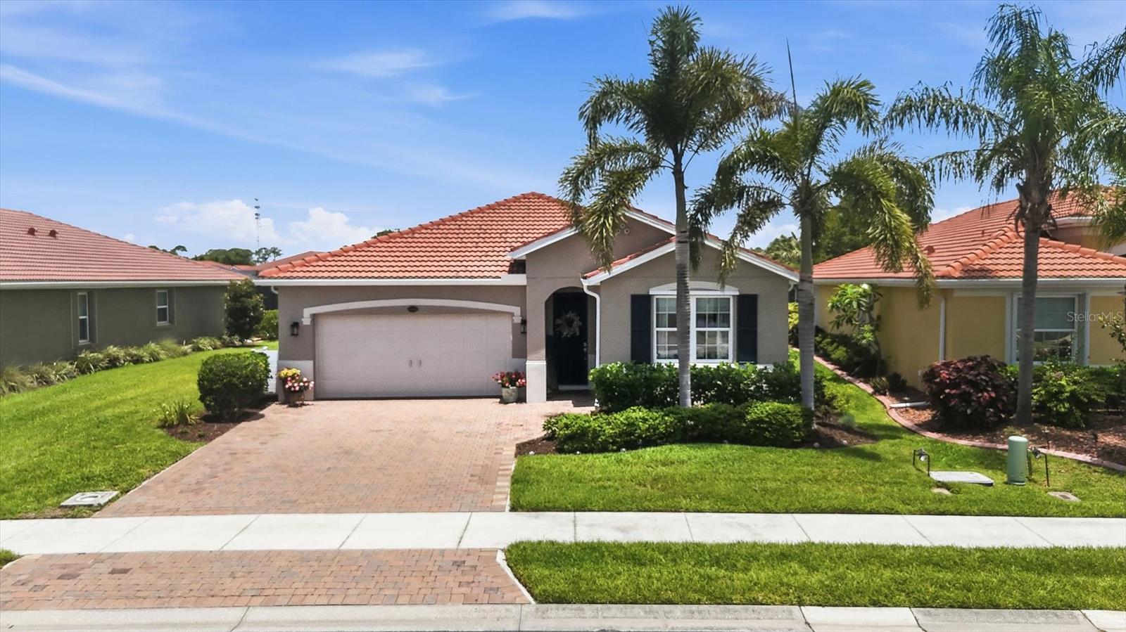 Welcome to this beautifully updated home in one of Venice’s most convenient and desirable locations! Featuring 2 spacious bedrooms plus a large office/den, this move-in ready residence offers the perfect blend of comfort, style, and Florida living. Recent updates provide peace of mind and modern appeal, including new luxury vinyl flooring throughout (2023), upgraded kitchen appliances (2023), a whole-house water filtration system (2026), and fresh exterior paint (2026). The kitchen includes an island with seating, newer upgraded appliances, and a corner pantry. The primary bedroom is spacious and has two walk-in closets with one of them having a well-appointed luxury custom organizer! The second bedroom and the office/den (currently being used as the 3rd bedroom) are at the other end of the house with the second bathroom. The conveniently located laundry room has cabinets, shelves, and a laundry sink. The open living spaces flow seamlessly between the kitchen, living room, and dining area to the extended lanai, where you can relax and enjoy tranquil pond views and peaceful backyard privacy. The extended lanai has room for growing herbs/vegetables or maybe add a hot tub. Additional highlights include hurricane shutters and being in a low-risk flood zone. 
Caribbean Village is a gated community with less than 200 homes built between about 2015 and 2019. It’s known for its tropical-inspired architecture, manageable neighborhood size, and convenient location. It has low HOA fees compared to many area communities and no CDD fee. This combination is increasingly hard to find in newer Venice communities. Caribbean Village has a heated community pool, clubhouse, fitness center, bocce ball courts, lawn and landscape maintenance. The location is excellent with plenty to do nearby. Immerse yourself in the dynamic energy of Downtown Wellen Park and Historical downtown Venice. Both downtowns feature live music, shopping, dining, cultural experiences, festivals, walking paths, and more. Baseball enthusiasts will love the proximity to Cool Today Park, a state-of-the-art sports facility that hosts exciting events year-round. This home is only a short drive from the pristine Gulf of Mexico beaches, offering sun-soaked days and breathtaking sunsets. Embrace the coastal lifestyle, make memories, and turn this home into your vacation home or your forever home.