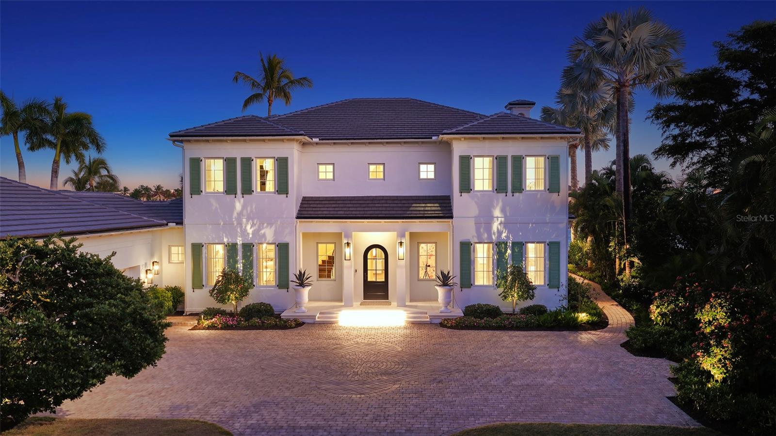 This bespoke crafted casually elegant furnished residence is in the exclusive gated Lighthouse Point waterfront enclave of just 16 custom residences at the southern tip of Longboat Key. Lighthouse Point is a peninsula nestled on a deep-water boat basin at the edge of the Intracoastal Waterway and New Pass. This residence has been completely remodeled within the past couple years, taken down to the studs to create the ideal coastal waterfront estate. Longfield Fitzgerald of Atlanta oversaw the interior design. The improvements included new impact glass windows and doors throughout and a new tile roof. The furnishings are chosen to make the space comfortable for both relaxing seaside living, as well as hosting family and guests. No detail has been overlooked. The first level includes an open floor plan with a living, family and dining room with a separate media room, and the fifth bedroom with double bunk beds for the little ones. Entering this stunning home, you are welcomed into a grand space, and beyond the beautiful kitchen with island seating, that includes the La Cornue French gas range as the focal point. The living and family rooms each have a gas fireplace. The main floor rooms overlook an expansive terrace and large heated pool with sun shelf chaises, back yard with plenty of space for games, private beach, and the Gulf of Mexico. Take the stately staircase or elevator to the second floor where the primary bedroom and three en-suite guest bedrooms are. The primary and two of the guest suites connect to a wide terrace overlooking the Gulf and Longboat Pass. Enjoy the Gulf’s vibrant sunset skies from the primary suite with spacious bedroom living space, meticulously appointed spa-like bath area, three walk-in closets and gas fireplace. There is a three-car side entry garage with room for storage. Down the street at the community dock is a new 16,000lb boat lift. Owners in the Lighthouse Point neighborhood enjoy their own tennis court plus the nearby gulf front beach, easy access to the Resort at the Longboat Key Club and the Links Golf Course and fitness center with famed St. Armand’s Circle shopping and dining district just over a mile away. Sarasota and its famed arts and entertainment is just 5 miles away. .