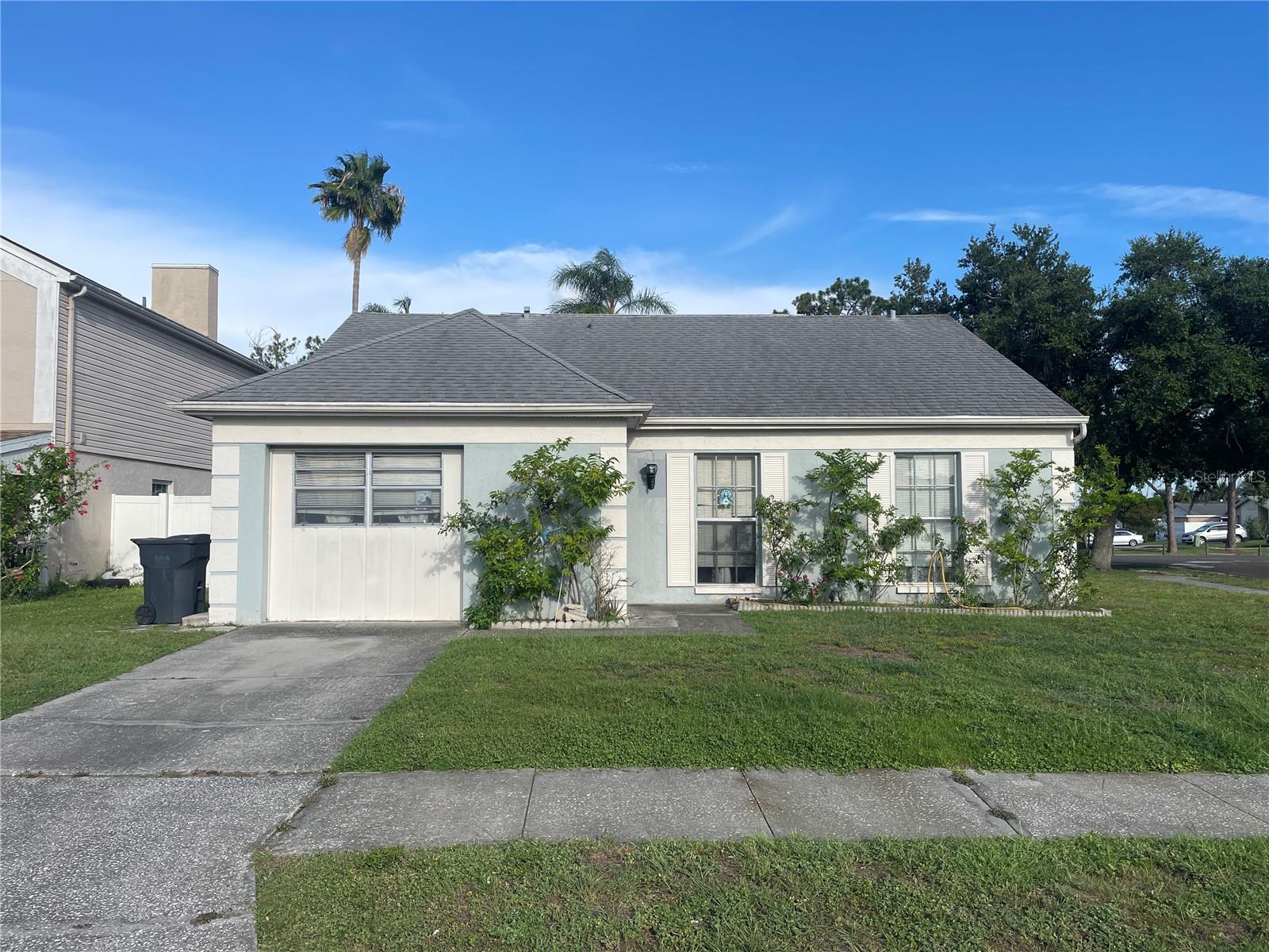 Welcome to the Plantation community of Carrollwood! This 3-bedroom, 2-bath home offers a functional split-bedroom floor plan with 1,314 square feet of living space, vaulted ceilings in the main living area, and elevated ceilings in the primary bedroom that create an open and airy feel throughout.

The home features tile and carpet flooring, a screened rear patio, and a fully fenced backyard with low-maintenance vinyl fencing, providing a private setting for relaxing, entertaining, or enjoying time outdoors. The layout offers comfortable everyday living with plenty of potential for a new owner to make the home their own over time.

Residents enjoy access to Plantation's extensive community amenities, including swimming pools, tennis and racquetball courts, basketball courts, parks, playgrounds, walking trails, and a clubhouse, all while being conveniently located near shopping, dining, major roadways, and everyday conveniences.

Whether you're searching for a primary residence or your next long-term home, this property offers a desirable combination of location, community amenities, and value within one of Carrollwood's most established neighborhoods. Don't miss your chance to explore all that this home and community can provide, schedule your private showing today!
