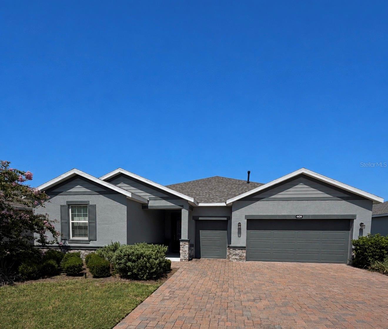 Located in one of the most desirable subdivisions on the NW side of Ocala, this beautiful modern-style home offers comfort, elegance, and an unbeatable location just 8 minutes from the World Equestrian Center (WEC).  This spacious property features 3 bedrooms, 3 bathrooms, plus a versatile den perfect for a home office, media room or guest space. Elegant barn doors add character and style to both the den and the guest bathroom. The open-concept floor plan seamlessly combines the kitchen, dinning area and living room, creating a bright and inviting space ideal for entertaining and everyday living. The modern kitchen is equipped with stainless steel appliances, ample cabinetry, and a functional layout. The bedrooms are generously sized, including a spacious primary suite and a guest bedroom with its own private bathroom, providing extra comfort and privacy for family or visitors. The home also includes a 2-car garage plus a third garage space perfect for parking a golf cart or extra storage. Step outside to enjoy the fenced backyard, perfect for pets, outdoor activities, or relaxing evenings. Residents of this highly sought-after community enjoy outstanding amenities, beautifully maintained common areas, and convenient access to shopping, dinning, and equestrian events. One of the best features of this part of the subdivision is that is open to all ages and is not restricted to 55+ residents only.