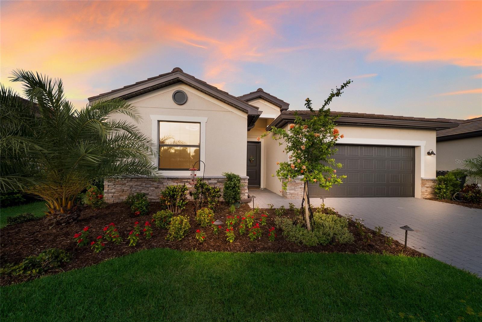 Discover the Ultimate Resort-Style Florida Paradise in the Highly Desired Community of Lorraine Lakes at Lakewood Ranch! This Spectacular 4-Bedroom, 3-Bathroom Single-Family Masterpiece is Loaded with Premium Upgrades and Ready for You to Move Right In. Step Inside to a Bright, Open-Concept Floorplan Designed for Seamless Living and Entertaining. The Gorgeous Great Room Features a Stunning STONE ACCENT WALL and UPGRADED LIGHTING Throughout. Every Detail Has Been Thoughtfully Addressed, Including Beautiful UPGRADED BATHROOM CABINETRY for Maximum Storage and Convenience. The Exterior Boasts Incredible UPGRADED LANDSCAPING That Creates Showstopping Curb Appeal the Moment You Arrive. Step Outside to Your COVERED AND SCREENED LANAI Offering Peaceful WATER VIEWS, Creating the Perfect Private Spot for Morning Coffee or Evening Relaxation. But the Real Magic of This Home is the Unmatched Lifestyle. Living in Lorraine Lakes is Truly LIKE LIVING ON A LUXURY RESORT Every Single Day! You Will Have Exclusive Access to PHENOMENAL WORLD-CLASS AMENITIES, Including a Massive Resort-Style Pool, a Splash Pad, a State-of-the-Art Fitness Center, Indoor Basketball and Volleyball Courts, Tennis, Pickleball, Bocce Ball, an Arcade, and Even a Full-Service Restaurant and Bar Right Inside the Clubhouse. Why Wait to Build When You Can Start Living the Ultimate Lakewood Ranch Resort Lifestyle Today in This Fully Upgraded Dream Home?