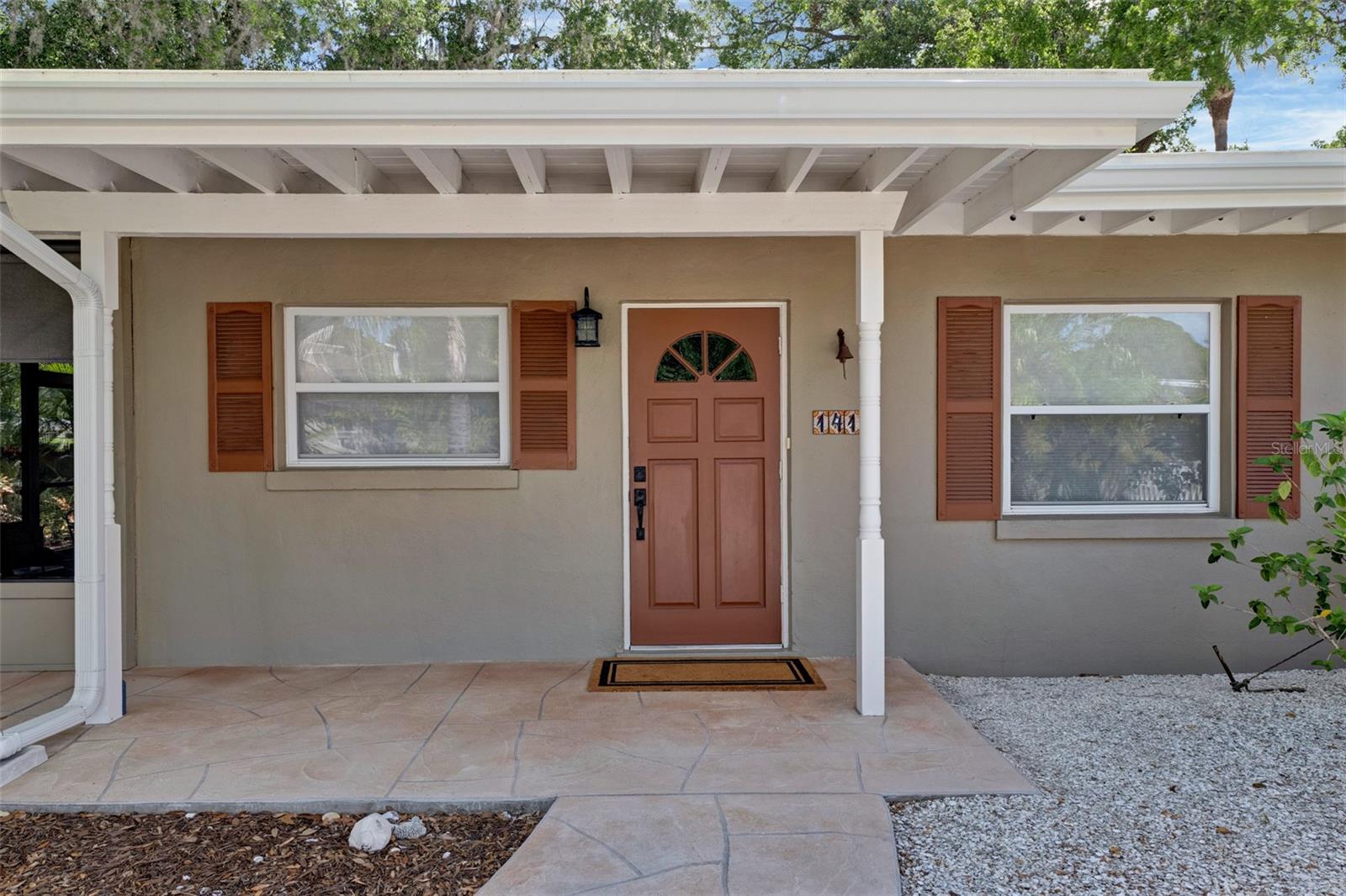 Sarasota midtown oasis in desirable Arlington Park Neighborhood. This 3 bedroom, 1 1/2 bath, TURNKEY FURNISHED (OPTIONAL) BLOCK home situated on a secluded corner lot, immaculately maintained and updated, could be yours as a primary residence or income producing rental property (7 DAY MINIMUM RENTAL).  New AC with warranty.  Roof: new APOC 585 silicone coating, newer double pane insulated windows with custom shades, tankless hot water heater, updated plumbing, new stainless steel appliances, granite countertops, IKEA kitchen cabinets and closet organizers. Terrazzo floors throughout with tile in both bathrooms.  Property is fully FENCED with 2 gates providing access and parking for a small boat, camper or vehicle. Screened lanai overlooks hardwood deck and tropical plant landscaped yard.  The city easement (a non build lot) on the east side of the property provides additional privacy.  NO FLOOD INSURANCE REQUIRED.  Located 2 blocks east of Sarasota Memorial Hospital, 4 miles to Siesta Beach (#1 beach in the USA), 5 miles to Lido Beach and 1 mile to Sarasota’s downtown world class shopping and entertainment. Short walk to Southside Village, Midtown Plaza, Legacy Trail and the Arlington Park & Aquatic Center hosting Live Music Events Alongside Pickleball, Tennis, Basketball Courts, Playgrounds, a Dog Park, Walking Trails, and Two Pools. Magical must see property!
