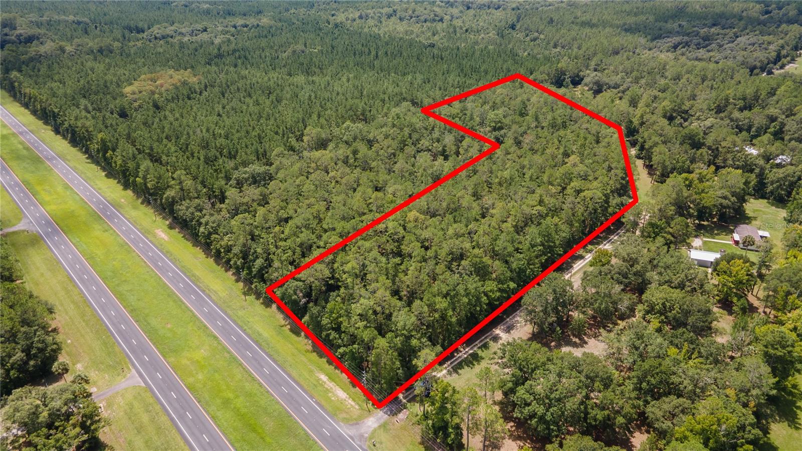 Welcome to your slice of paradise in Hawthorne, Florida. 7.41 acres situated in a quiet neighborhood. Great opportunity to build your dream home on this beautiful property less than 15 minutes to Gainesville and Shands. It is a short 5 minute drive to downtown Hawthorne town center, antique shops, restaurants, and shopping. Whether you're seeking to build your dream farm home, create a unique retreat, or invest this 7.41 acres offers endless possibilities! As Hawthorne continues to grow don't miss out on this rare opportunity to embrace the best of both worlds – serene countryside living with easy access to city amenities. Lot is high and dry, zoned agriculture, and also has access to electricity. No HOA or deed restrictions.