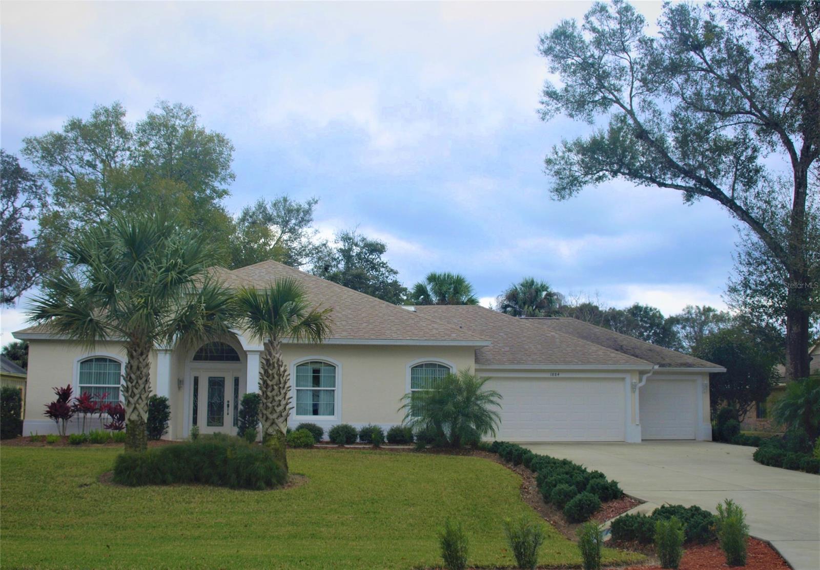 Energy Efficient 3-Yr New Golf Course Home on 7th Fairway in prestigious Spruce Creek Fly In, a 24/7 secure/gated community. This custom home was completed in Dec.,2017 & offers 3 Bedrooms, 2 Baths, a full 3-Car Garage & an open floor plan with 10' ceilings throughout. Kitchen has 42'' maple cabinets with crown molding, soft-close drawers, pull-out shelves, stainless appliances, granite countertops & snack bar open to the Great Room. Great Room has 10' recess ceiling with crown molding & glass sliders that overlook the golf course. Owners Suite has large walk-in closet & large walk-in shower. Charming covered Lanai offers a great view of the golf course. Hybrid smart grid water heater & smart A/C system help with the energy efficiency of this home. Average Monthly Electric Bill is $77; Annual homeowners' insurance bill was only $612. Well & irrigation system for the lawn. Keypads & remotes to open the garage doors. Plenty of room for a pool. Furnishings are available exclusive of the sale price.....
The luxury & quality found in Spruce Creek Fly-In is unmatched as an ideal family community. The private airport (7FL6) has a paved 4,000 foot runway, paved taxiways, a helipad, GPS approach, VASI lights, aviation fuel pumps, guest tie-down spaces and aircraft services. Spruce Creek Fly-In also offers an Optional Membership Country Club with tennis, pickleball, golf, fitness facilities, a private restaurant and pool. The community has parks, an on-site restaurant, hair & nail salon, skin care, acupuncture & massage boutiques, law office, aircraft sales & avionic repairs and several other professional businesses. It is close to retail stores, schools, commercial airports, recreation areas and Embry-Riddle Aeronautical University. ;Water: City