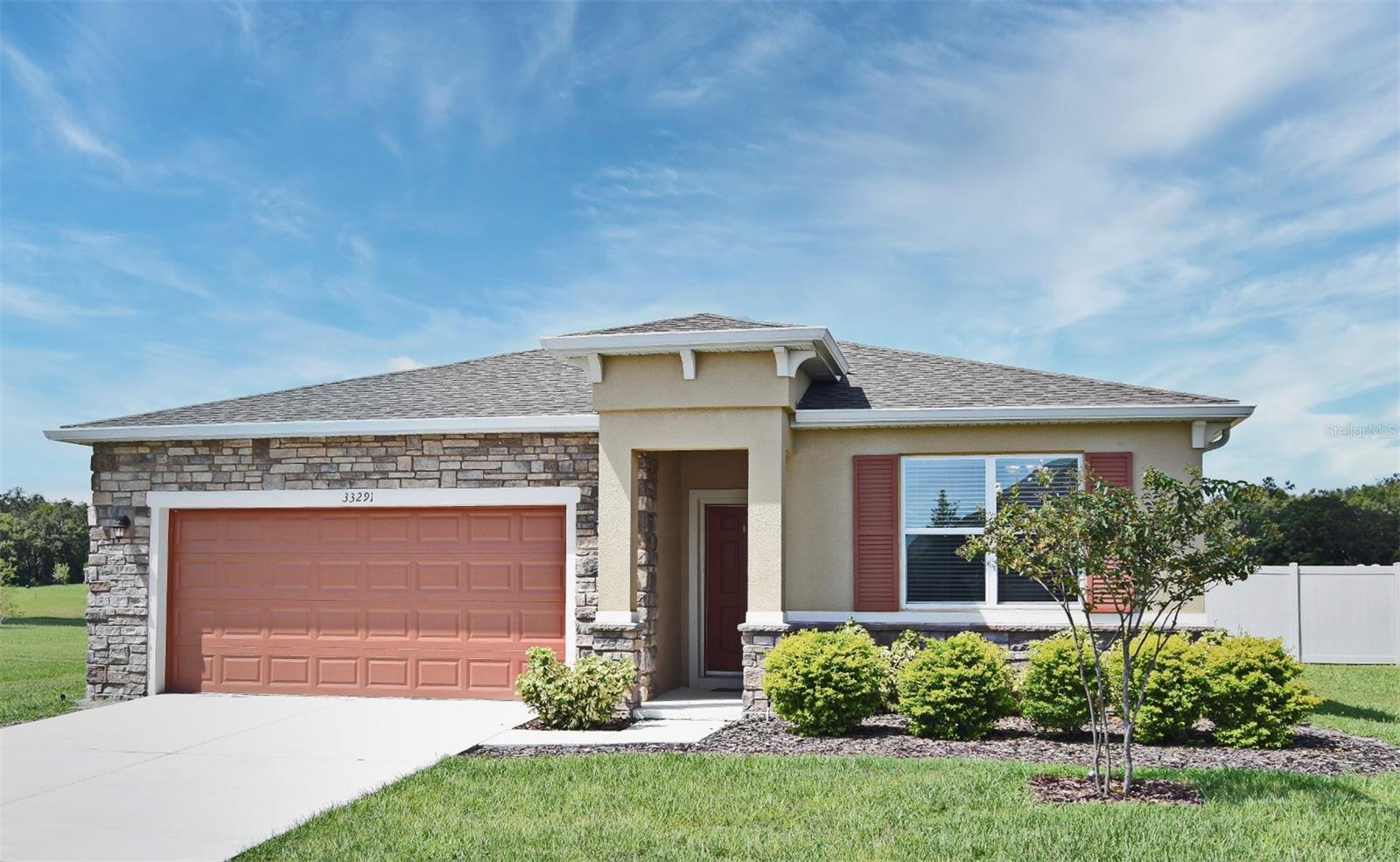 Built with quality craftsmanship, this home features a split floor plan and smart home technology for modern convenience. The smart kitchen is designed for everyday use and entertaining. Enjoy scenic views with no rear neighbors, thanks to the home’s position backing up to greenspace. A fenced yard and extended deck add outdoor living space, perfect for relaxing or hosting. Located in a growing community, you'll appreciate access to a community playground, pool, and dog park areas. This home provides easy access to Apopka, Orlando, and major highways, making commuting and daily travel convenient. Nearby amenities include Publix Super Market at Sorrento Hills Village, just over a mile away, and the East Lake Sports & Community Complex, less than two miles away. Nature and recreation options like Rock Springs and the popular town of Mount Dora are just a short drive away. With no need to wait for new construction, this home offers an excellent opportunity at a desirable price point. It combines practical features, thoughtful layout, and access to nearby conveniences and attractions. Whether you're looking for a family home or a low-maintenance property in a well-located community, this residence meets the need. Don’t miss out on this new listing in one of Sorrento’s growing and welcoming neighborhoods