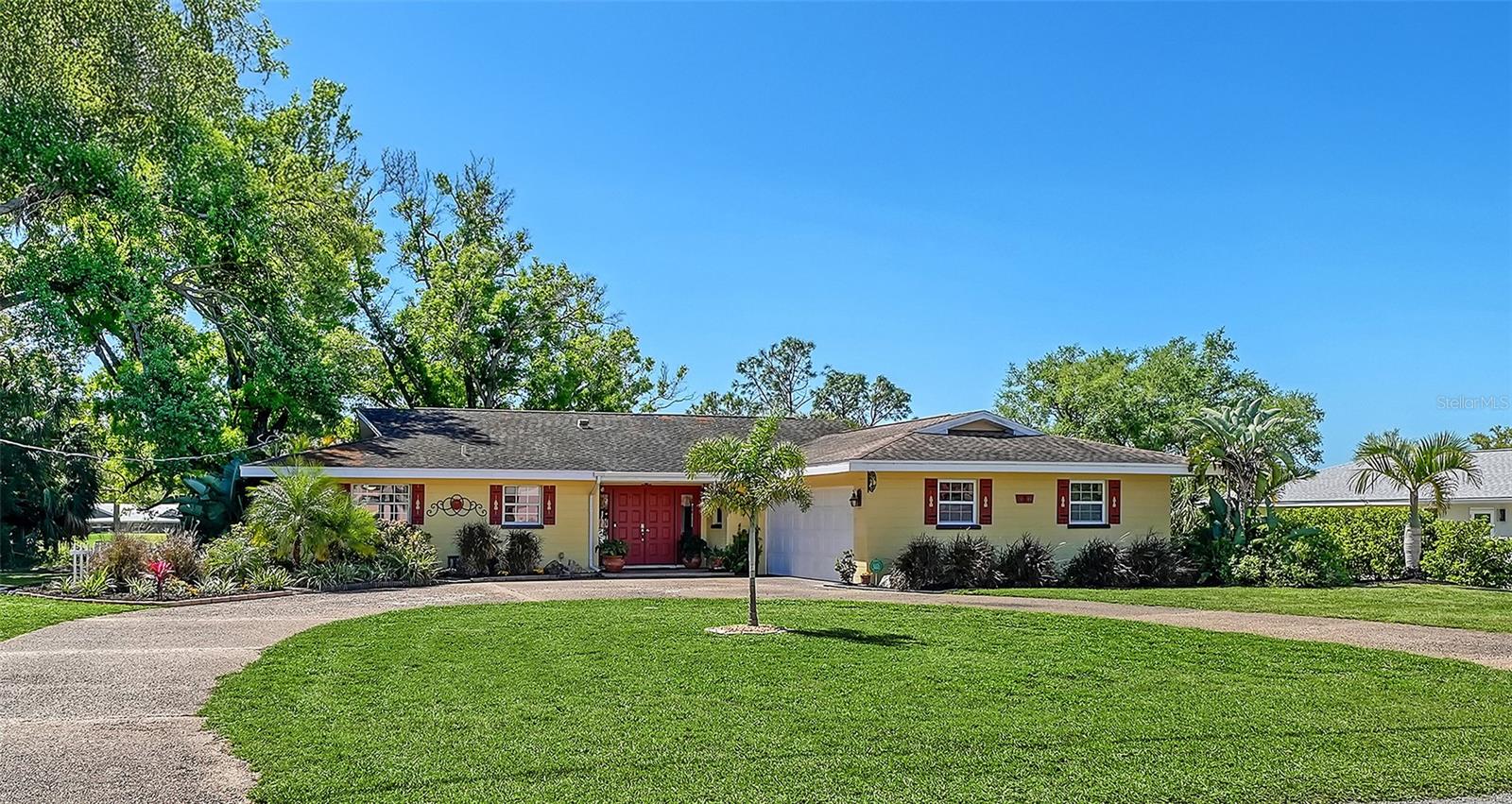 One or more photo(s) has been virtually staged. Enjoy sweeping golf course views and classic Sarasota charm from this spacious residence overlooking the 15th hole of historic Sara Bay Country Club, the renowned Donald Ross-designed course established in the 1920s. Situated on an oversized 18,750 sq. ft. lot, this property offers a rare opportunity to enjoy generous indoor and outdoor living space in one of Sarasota’s most established golf course communities. Designed for comfortable everyday living and entertaining, the open great room floor plan flows seamlessly to the expansive patio and outdoor living areas where panoramic fairway views create a beautiful backdrop for relaxing or gathering with family and friends. A private putting green adds to the home’s golf-inspired setting, while the spacious backyard offers exceptional flexibility for future outdoor enhancements tailored to your lifestyle. The kitchen features granite countertops, solid wood cabinetry with soft-close drawers, and convenient roll-out shelving. The oversized primary suite includes a spacious sitting area, walk-in closet, and private bath, creating a comfortable retreat within the home. The second bedroom features a large walk-in cedar closet, while the third bedroom, currently used as a home office, easily adapts as a guest room, den, or flex space. Additional highlights include an oversized garage with workshop area, ideal for hobbies, storage, or projects. Conveniently located just minutes from downtown Sarasota, Sarasota-Bradenton International Airport, shopping, dining, cultural venues, and Gulf beaches, this property presents an exceptional opportunity to enjoy golf course living with space, privacy, and potential in a highly desirable Sarasota location. Offering one of the larger homesites in the neighborhood along a historic Sarasota fairway, this property combines location, lifestyle, and value with the opportunity to personalize and make it your own.