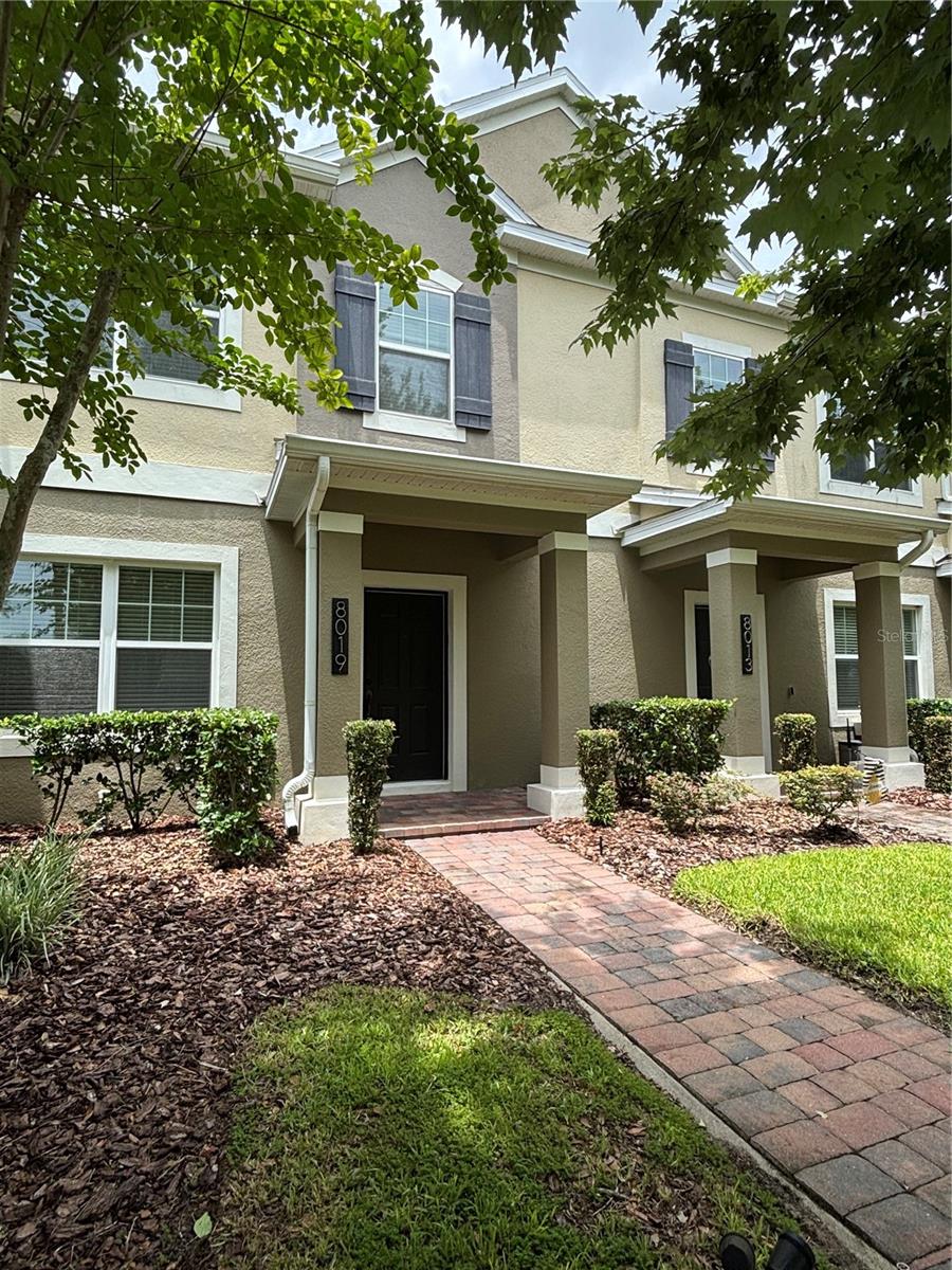 Discover this **stunning and meticulously maintained** 3-bedroom, 2.5-bath home, presented in **excellent condition**. The interior has been **freshly painted**, featuring **granite countertops** in both the kitchen and bathrooms. The kitchen is equipped with **stainless steel appliances**, a **spacious island**, a large breakfast bar, and an inviting eat-in area.

Enjoy **new flooring throughout the downstairs** in this lovely home. The **generous primary bedroom** is located upstairs and includes an ensuite bath with dual sinks, a roomy shower, and a walk-in closet. The secondary bedrooms are thoughtfully arranged in a **split plan**, ensuring privacy from the primary suite.

Convenience continues with a downstairs laundry room featuring hookups. Step outside to a **private, expansive paved lanai**, perfect for entertaining, barbecuing, or relaxing. A large **green space** is just off the front porch.

Located just 10 minutes from Disney property, this home is close to all parks, restaurants, shopping, and entertainment. Hamlin Town Center is only a few miles away, and **Orange County National**, the largest golf course in Florida, is nearby. 

The community offers **resort-style amenities** just steps away, including a pool, two parks, a dog park, pickleball courts, green spaces, and tennis facilities. Enjoy low-maintenance living with the HOA covering exterior upkeep, including roof care, yard maintenance, exterior painting, and lawn care. 

This home is situated in a **top-rated school district** and boasts a **superb location** with ample parking. Townhomes in this **highly sought-after community** rarely become available. This property is **move-in ready** for its new owners! All info should be verified.