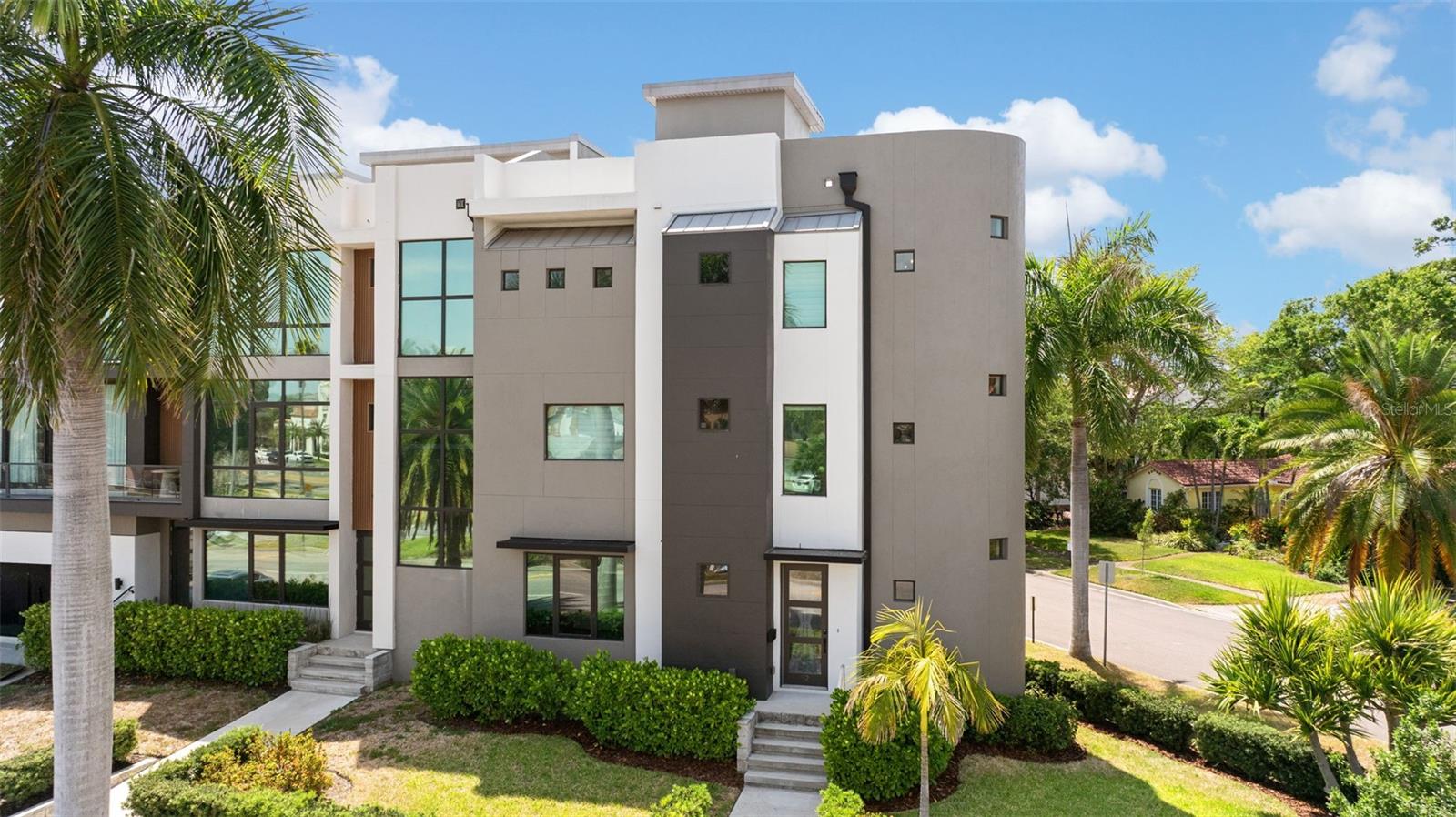 Welcome to elevated living in the heart of Davis Islands. This luxury custom-crafted, off-market opportunity presents a rare chance to own a sophisticated corner-unit townhome in one of Tampa's most exclusive neighborhoods.  Built in 2022, this exceptional residence offers 3 bedrooms, 3 full bathrooms, and a half bath across a thoughtfully designed open floor plan filled with natural light. The corner positioning enhances privacy and creates a bright, airy atmosphere throughout.  A private in-unit elevator provides seamless access to all levels, leading to a stunning rooftop lounge and multiple terraces designed for both entertaining and relaxing. The interior showcases high-end finishes, including wide plank wood flooring, a designer kitchen with quartz countertops, premium cabinetry, and top-of-the-line appliances.  The spacious primary suite serves as a private retreat, featuring a spa-inspired bathroom, dual vanities, and a generous walk-in closet. Additional highlights include impact windows, block construction, high ceilings, and refined modern architecture.  Ideally located just moments from Davis Islands Village, downtown Tampa, Water Street, and the Riverwalk, this home offers a walkable lifestyle surrounded by premier dining, shopping, and waterfront experiences.  A truly unique, off-market luxury offering designed for those seeking exclusivity, quality, and location.