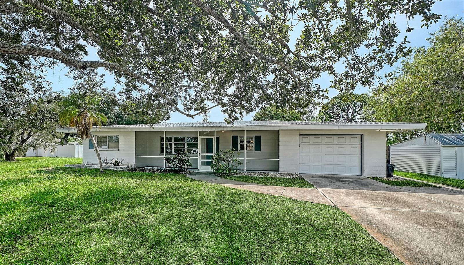Opportunity knocks at 5938 Murdock Ave, a 2-bedroom, 1-bathroom home offering 1,381 square feet of potential in the heart of Gulf Gate Estates. Priced to invite your imagination, this residence is a rare canvas for buyers eager to build sweat equity in one of South Sarasota's most established and convenient neighborhoods.

Set on one of the area's largest lots, the property enjoys a coveted position beside a tranquil pond — meaning no neighbors on one side and daily visits from Florida's wildlife. A screened front porch greets you, while a back screened lanai overlooks a sprawling backyard perfect for gardening, gathering, or simply unwinding.

Inside, an eat-in kitchen flows into a comfortable living room and a flexible bonus room ready to adapt to your needs. The laundry room off the garage presents a smart opportunity to add a second full bathroom, boosting both function and value. A one-car garage and separate storage shed round out the practical features, and recent upgrades — including a new roof and new water heater — give you a solid foundation to renovate with confidence.

The location is unbeatable. You're moments from Gulf Gate Elementary, Riverview High School, Publix at Sarasota Pavilion, and easy I-75 access. The world-famous white sands of Siesta Key sit just minutes away, adding genuine VRBO income appeal.

Ready for a new generation to make it shine, this is your chance to transform potential into a personalized Sarasota retreat.