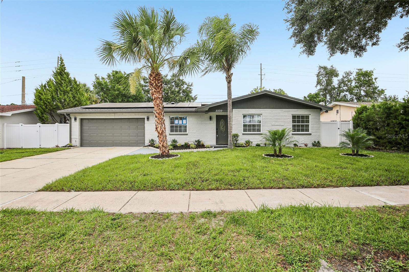 Welcome to a truly exceptional 4-bedroom, 2-bath pool home that has been completely remodeled from top to bottom with high-end finishes, thoughtful design, and meticulous attention to detail. Tucked away at the end of a quiet street, this move-in-ready residence offers the perfect blend of luxury, comfort, and energy efficiency with fully paid-off solar panels, a private swimming pool, and  luxurious upgrades throughout.
New roof April 2026, New ac may 2026,new pool screen .
At the center of the home is a stunning chef's kitchen designed to impress, featuring shaker-style cabinetry, quartz countertops, premium stainless steel appliances, a massive center island with seating, and abundant storage. The open-concept floor plan flows seamlessly between the kitchen, family room, and living room, creating a bright and inviting space ideal for both everyday living and entertaining. Expansive sliding glass doors fill the home with natural light and create a seamless connection to the outdoor living areas.
Every inch of the interior has been thoughtfully updated, including beautifully remodeled bathrooms showcasing floor-to-ceiling porcelain tile, custom vanities, and spa-inspired fixtures. Fresh interior and exterior paint, a brand-new roof, a new garage door, and designer finishes throughout further elevate the home's appeal.
Step outside to your own private backyard retreat. The oversized screened lanai overlooks a sparkling in-ground swimming pool, professionally installed turf entertainment area, and fully fenced backyard, creating the perfect setting for weekend gatherings, family fun, or quiet evenings at home.
Conveniently located near the corner of Sunset Point Road and Belcher Road, you'll enjoy easy access to shopping, dining, parks, top-rated amenities, Downtown Safety Harbor, the Gulf beaches, Tampa International Airport, and major commuter routes including US-19. Rarely does a home combine this level of renovation, outdoor living, location, and value. Schedule your private showing today and experience firsthand what makes this property stand out from the rest.