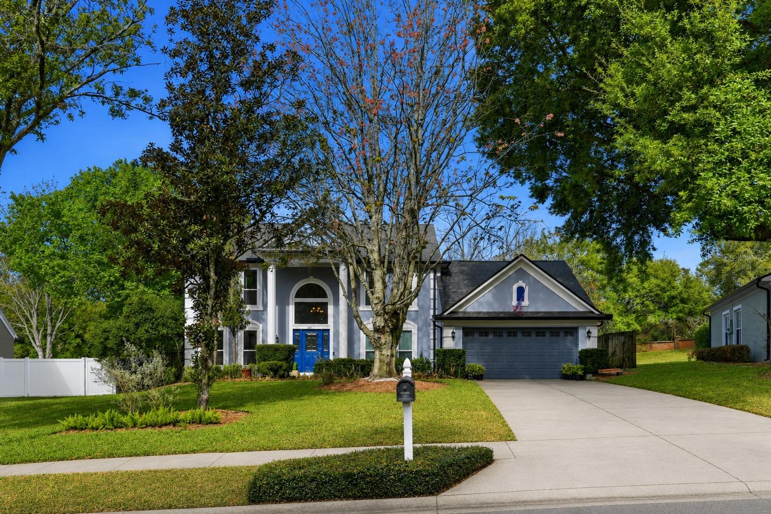AMAZING OPPORTUNITY — Welcome to this beautifully maintained pool home in the lakefront community of Lake Olympia North Village. Situated on an oversized lot, this spacious two-story residence offers 3 bedrooms (with office space that could be used as a 4th bedroom), 2.5 bathrooms, and over 2,300 square feet of living space, blending comfort, functionality, and timeless style. From the moment you arrive, the home impresses with its grand two-story entry and large arched window, filling the foyer with natural light. The formal dining room features attractive wood flooring and upgraded windows, creating an elegant space for entertaining. A dedicated home office tucked off the living room (currently being used as a spacious playroom) provides a great workspace with views of the backyard. The heart of the home is the spacious family room with a cozy wood-burning fireplace, seamlessly connecting to the kitchen and outdoor living areas. The kitchen features granite countertops, wood cabinetry, stainless steel appliances, and a large eat-in nook, making it perfect for both everyday living and hosting guests. Upstairs, all bedrooms are thoughtfully arranged for privacy. The primary suite offers vaulted ceilings, walk-in closet, and a spa-inspired bathroom with double vanity, a jetted soaking tub, and separate shower. Step outside to your private backyard oasis, complete with a covered lanai, expansive paver patio, and sparkling pool—ideal for relaxing or entertaining year-round. The lush landscaping and garden space add to the tranquil outdoor setting. Newer roof (2022), creates peace of mind for the next owner. Conveniently located near shopping, dining, and major highways including SR-429, SR-408, and the Florida Turnpike, this home provides easy access to downtown Orlando, Winter Garden, and Central Florida attractions. This move-in-ready home combines space, privacy, and location—a rare opportunity in this sought-after community.