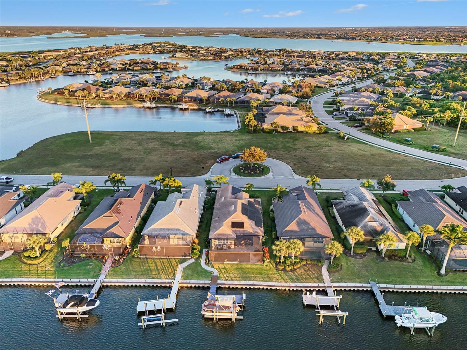 Why settle for a canal when you can have a lake (WITH access to the Gulf)?  Wake up to soft water views, warm morning light, and the kind of peace that makes home feel like an escape. From the moment you arrive through the gated entry and pull onto the sweeping paver driveway with professional lighting, everything about this property feels designed to slow life down in the best possible way.

Open the wall of sliding glass doors and let the coastal breeze move through the living spaces. Spend quiet mornings with coffee overlooking the water, easy afternoons on the lanai, and evenings beside the saltwater pool as the waterfall spills into the background. And when you are ready to get out on the water, you do not have to wait for some future plan to make it happen. This home includes a private dock and 12,000 lb boat lift, so your waterfront lifestyle starts the moment you move in.

Inside, the home blends warmth and function with thoughtful design throughout. Exposed wood ceiling beams bring character to the main living area, creating a space that feels both elevated and inviting. The kitchen has been beautifully refreshed with granite countertops, a gas range, neutral tile backsplash, and reverse osmosis water system. A dedicated office with French doors gives you privacy when needed, while the split layout offers a comfortable guest wing with two bedrooms connected by an updated Jack and Jill bath.

The primary suite feels like its own retreat, highlighted by shiplap tray ceilings and a spa inspired bath with custom framed mirrors, a soaking tub, and a glass enclosed shower. Every space has been carefully considered to make daily living feel easy, comfortable, and refined.

Beyond the home itself, Tidewater Preserve adds another layer to the lifestyle with gated entry and a resort style setting along the Manatee River. Residents enjoy access to resort style amenities that make it easy to stay active, social, and connected to the waterfront setting.

Just as appealing is how connected it feels when you leave the gates. The location offers convenient access to I 75, UTC shopping and dining, downtown Bradenton’s waterfront, the airport, and the area’s well known beaches, so it is easy to enjoy both a tucked away waterfront setting and the everyday convenience of being close to the places people actually want to go.

Outside, the lanai is enhanced with Clearview screening for panoramic water views and motorized screens for added comfort. The finished garage features epoxy flooring and built in storage, while practical upgrades like a whole home water softener, laundry room utility sink, and generator hookup add convenience behind the scenes. Leased solar panels are also in place and can be assumed by the buyer or removed depending on preference.

This is the kind of home that makes it easy to picture a different pace of life. More time outside. More time on the water. More mornings that start slower and evenings that last longer.