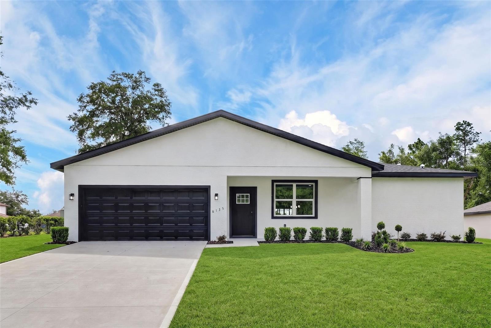 One or more photo(s) has been virtually staged. Huge opportunity! New home in Citrus Springs and no HOA. Discover a blend of comfort, style and value in this beautiful new construction home featuring four bedrooms, two baths and 1,845 square feet of thoughtfully designed living space on a generous 0.23-acre lot. Go inside to an open and inviting floor plan with soaring ceilings, abundant natural light and modern finishes throughout. The heart of the home is the stunning kitchen, complete with quartz countertops, white shaker cabinetry, stainless steel appliances, and a spacious island ideal for gathering with family and friends. The owner's suite offers a private retreat with dual sinks, a walk-in shower and a large walk-in closet. Luxury vinyl flooring and contemporary details add elegance and durability throughout the home. Conveniently near golf courses, parks, shopping, and just a short drive to Dunnellon and Crystal River, this property is ideal for homeowners and investors looking to be part of one of Florida's fastest-growing communities. Don't miss your chance to own a new home in Citrus Springs and schedule your private showing today.