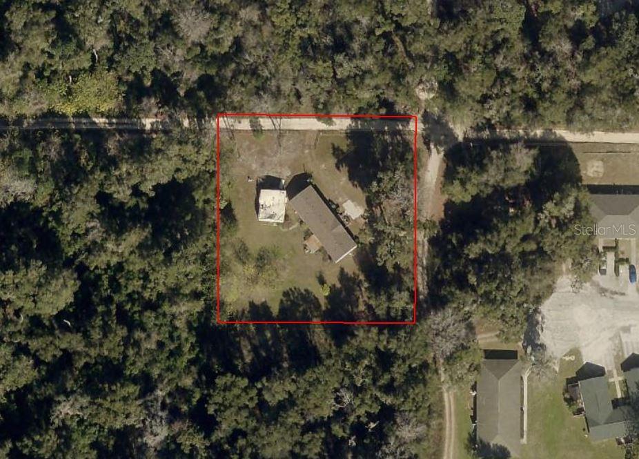 Property in great Central location. Of Ocala is a five bedroom two bath mobile home on 1 acre. This mobile home is very spacious with a cathedral ceiling. The property is very close to saddle Wood school and the new SW. 43rd Court, Four lane north south road. Great location gives quick access to shopping medical and entertainment in the area. Very close to market Street at Heathbrook Roof is three years old property is not in a subdivision and is zoned A1. Property is offered as is there is no floor covering presently. There is some final in the master bedroom. This mobile home offers large space on larger lot in a great location. There is a damaged two car garage on the property that will not be repaired. Good slab underneath and electric. Property offered as is once again. Please schedule an appointment to see this property.