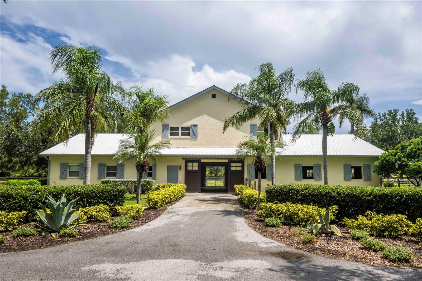 Welcome to a truly unique opportunity in the heart of Lakewood Ranch! This rarely available 9.7-acre property is nestled within the exclusive Sarasota Polo Club, offering a premier equestrian lifestyle just minutes from all the conveniences of town.

As you enter through the gates, you’re greeted by a stately oak-lined driveway that sets the tone for this remarkable estate. The property features a gorgeous 8-stall center-aisle barn with a spacious office, tack room, and a beautiful 2-bedroom, 2-bathroom apartment upstairs — perfect for owners, guests, or staff.

In addition, there’s a 16-stall barn complete with a 1-bedroom apartment, providing ample accommodations for horses, grooms, and trainers. Both barns are thoughtfully designed for functionality, comfort, and the highest standards of equine care.

Located within minutes of the acclaimed Out-of-Door Academy, this property is also a quick golf cart ride to Waterside, Lakewood Ranch where you can enjoy boutique shopping, lakeside dining, weekly events, and so much more. With ample space to build your dream home, this estate offers endless possibilities for creating your perfect equestrian retreat.

Whether you’re a polo player, competitive rider, or simply a horse enthusiast, this property offers an unmatched combination of location, facilities, and charm. Enjoy the prestige of the Sarasota Polo Club community while being just moments from shopping, dining, schools, and Lakewood Ranch’s vibrant amenities.

Don’t miss this chance to own one of the area’s most coveted equestrian properties!