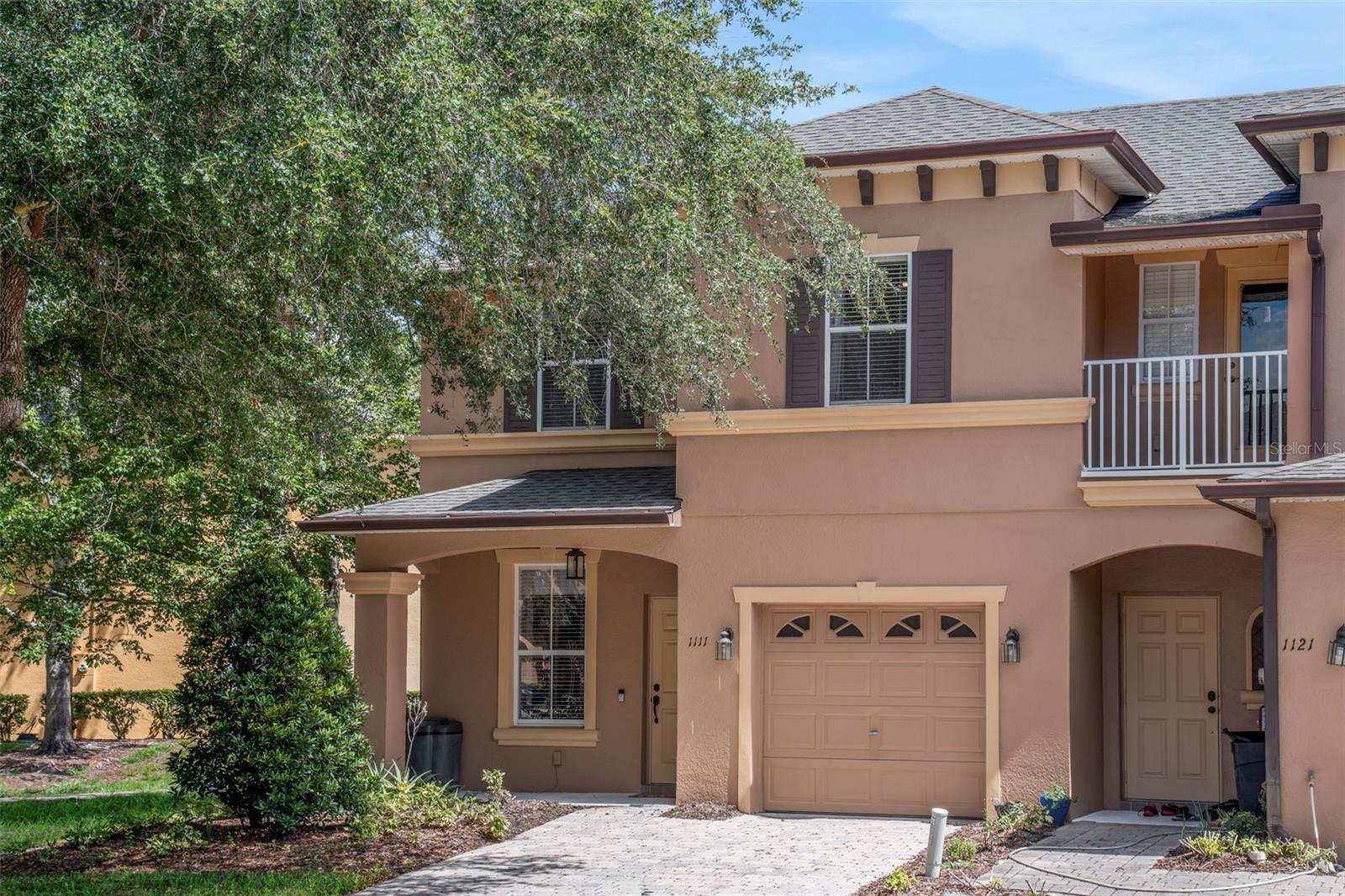 Welcome to this beautifully updated 3-bedroom, 2.5-bath end-unit townhome in the gated Retreat at Twin Lakes community in Sanford. Ideally positioned on a desirable corner lot and framed by mature trees, this inviting residence offers added privacy, tranquil water views, and a wonderful combination of comfort, style, and convenience. Step inside to a bright, open floor plan designed for both everyday living and entertaining. The spacious living and dining areas flow seamlessly into the upgraded kitchen, featuring granite countertops, stainless steel appliances, abundant cabinetry, and generous prep and storage space. This home has been thoughtfully maintained and enhanced with numerous recent improvements, including a new roof, new HVAC system with whole-house air purifier and UV light installed August 2023, new water heater installed August 2023, new carpeting installed September 2023, and interior painting completed August 2023. The upstairs bathroom has also been beautifully renovated, and a new washing machine was installed June 2026. Upstairs, the spacious primary suite provides a peaceful retreat with an ensuite bath and sliding glass doors opening to a private balcony overlooking the water—the perfect setting to relax and enjoy the serene surroundings. Two additional bedrooms provide flexibility for family, guests, a home office, or fitness space. Wi-Fi-enabled light switches add another touch of modern convenience.
Outside, mature trees create a private, shaded setting complemented by peaceful water views. The patio provides additional space for outdoor dining, entertaining, or simply enjoying the Florida lifestyle. Residents of Retreat at Twin Lakes enjoy community amenities including a swimming pool, clubhouse, and scenic walking areas, all within the privacy of a gated neighborhood. Conveniently located in Sanford with easy access to SR 417, I-4, and SR 429, the home provides excellent connectivity throughout Central Florida, including Lake Mary, Oviedo, UCF, Lake Nona, Orlando's world-renowned attractions, shopping, dining, entertainment, and employment centers. Move-in ready and filled with valuable recent improvements, this exceptional end-unit townhome offers privacy, water views, modern upgrades, and an outstanding Central Florida location.  This property may be under audio/visual surveillance.