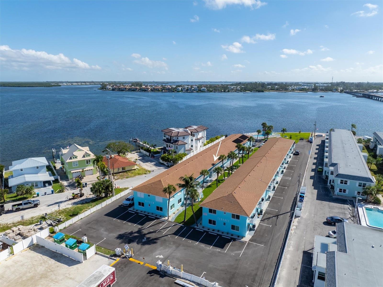 Back on the market with a “Substantial Market Adjustment”. Welcome to Bay View Terrace Condominiums, a secluded 40-unit complex overlooking beautiful Anna Maria sound. It is accessible at the end of 7th St N in Bradenton Beach behind a new electronic gate. Although not a gated community, it does provide privacy and prevents beachgoers from parking on the property. The complex is within walking distance of all the restaurants and shopping in Bradenton Beach. The complex has an in-ground pool and patio overlooking the intercoastal. Alongside the pool is a community gas grill for everyone’s use. There are community kayak storage racks for use by the residents and their guests. The property had a brand-new seawall installed in 2019. From here you can watch Manatees and Dolphins in the blue waters of Anna Maria Sound. Enough about the complex, let’s talk about your new home away from home. The condo is located on the second floor and was totally and completely unaffected by the hurricanes of 2025. The front of the condo faces to the southwest, filling the unit with sunshine every day. When you enter the home, you are welcomed by an open-floor plan connecting the kitchen, dining area and living room. There is a breakfast bar between the kitchen and dining area. These renovations were done approximately 10 years ago. The home has one bedroom and one full bath. In the bedroom is a sliding glass door leading to a private balcony that overlooks Anna Maria Sound to the northeast. On a clear day or night, you can see the Sunshine Skyway Bridge off in the distance. The home is being sold turnkey furnished as you can see in the photos. Outside the door to your left is a community storage room where the unit has a locked floor to ceiling storage bin for your use. There is also a coin operated laundry room directly beneath your condo making it easy to access. The condo association is self-managed and has one of the lowest quarterly fees on the island. The association has brought the complex back to better than new. The buildings have new roofs  and the exteriors totally repainted, all the decking and stairs have been refinished in slip proof coatings. It has been completely re-landscaped, the parking lots paved and repainted, and there is a new electronic gate for easy access. Set up a showing today.