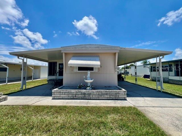 WELCOME TO YOUR HOME SWEET HOME at 10818 Freedom Dr, Port Richey in the gated community of Senate Manor, a 55+ cooperative community in SUNNY Florida. This 1973 SUPERB 2 bedrooms + large FL room, 2 bathrooms mobile home lies on a nice lot with just over 4,000 sqft in a NO CDD zone. Key exterior features are covered front porch where you can meet & greet your neighbors, 2 entrances into the home, rain gutters, window shades for storm protection, carriage lights, private mailbox & easy-breezy TROPICAL landscaping that is taken care of for you. AMAZING SYSTEM UPDATES to the home done properly & permitted with the county are LIKE NEW roof-over (2/2021), windows & acrylic slides in the Florida room (3/2019), AC (1/2015), electrical (1/2015) & extra tie-downs to secure this home on its foundation. There is a HUGE carport for your vehicle and/or golf cart, skirting around the perimeter to prevent unwanted critters & storage sheds for your garden & beach gear. When you step inside, you'll LOVE the OPEN FLOOR PLAN consisting of the eat-in-kitchen, living & dining rooms & SPACIOUS lanai/Florida room. The Florida room with double-glass sliding doors & newer windows adds 180 sqft to the home for a heated/cooled space of 852 sqft which is not reflected in public records. The WONDERFUL kitchen features a double sink, PLENTIFUL wood cabinets, pantry closet & updated appliances. The primary bedroom can fit king furniture & has dual closets, wall light sconces & a built-in dresser. In this split bedroom plan, the second bedroom & en-suite bathroom are located at the front of the home. This bedroom has built-in dresser & closet. The PRIVATE bathroom features sink with vanity, step-in shower & newer toilet. The main bathroom consists of newer toilet, linen closet, lots of counter space & tub/shower combination with glass sliding doors & grip handles for added safety. The CONVENIENT storage shed with approximate dimensions 13'x5' is where the laundry machines are located. This mobile is sold FURNISHED for immediate enjoyment by the LUCKY BUYER! Senate Manor is a GLORIOUS RESIDENT-OWNED 55+ COMMUNITY & included in the low HOA fee of $200/month is trash with recycling pick-up 2X week, all exterior lawn maintenance, water, sewer, street lights, water with fountain views, gates & recreational activities like HEATED POOL & SPA, shuffleboard, horseshoes & gym. There is optional storage for boats, RVs or trailers on site. Location is IDEAL near beaches, shopping, restaurants, medical plazas, places of worship & tourist attractions. MAKE THIS YOUR FUTURE HOME!