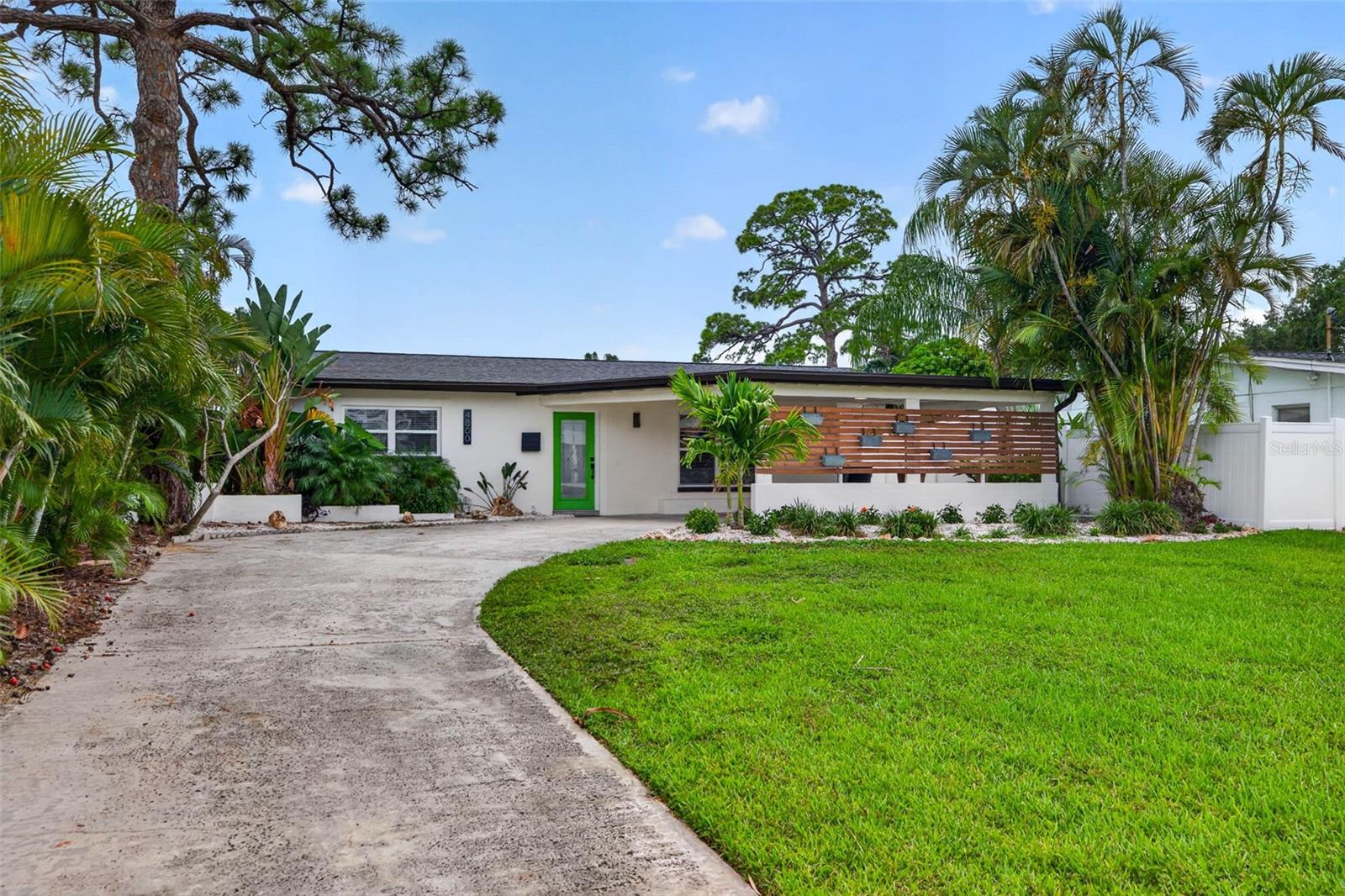 Welcome to your own boaters waterfront paradise, where the water isn't just a view—it's an extension of your backyard lifestyle. Perfectly positioned on 60' of boating water frontage, with plans for a dock, boat lift and ample room for a pool, this captivating coastal retreat allows you to step aboard your boat and reach the open waters of Tampa Bay and the Gulf within minutes. Nestled within one of Northeast St. Petersburg's most sought-after waterfront enclaves, this beautifully reimagined three-bedroom, three-bathroom residence masterfully blends modern design, effortless elegance, and the very best of Florida waterfront living. Imagine beginning each day with breathtaking sunrises shimmering across the water, enjoying your morning coffee from the waterfront as dolphins glide past, and ending your evenings with waterfront sunsets from the comfort of your own backyard. Situated on the ultra-wide end of a canal, this exceptional property offers a rare combination of privacy, boating convenience, and year-round natural beauty. Inside, an airy open-concept floor plan immediately welcomes you with a sophisticated yet relaxed coastal aesthetic. Every major improvement has already been completed, including a new HVAC system, newer seawall, updated electrical, new water heater, premium finishes, and extensive designer renovations throughout, creating a truly turnkey and worry-free ownership experience. The stunning kitchen serves as the heart of the home, showcasing custom cabinetry, elegant quartz surfaces, designer lighting, and sleek stainless-steel appliances. Whether hosting friends or enjoying a quiet evening at home, this thoughtfully designed space is both functional and beautiful. Conveniently located nearby are a full bathroom and spacious interior laundry room. The versatile waterfront rear room captures breathtaking water views and offers endless flexibility as a family room, office, media room, or additional entertaining space. Throughout the home, updated windows bathe every room in natural light, creating a warm and inviting atmosphere. Fresh interior and exterior paint, lush tropical landscaping, a newer irrigation system, and additional exterior storage further enhance the home's appeal and functionality. Retreat to the tranquil primary suite, where unobstructed water views create the perfect backdrop for relaxation. The spa-inspired ensuite bath features elegant tile work, a custom vanity, and thoughtfully curated luxury finishes. French doors open seamlessly to your waterfront oasis, where ample room remains for a future pool and where the backyard becomes the ideal setting for sunset cocktails, weekend gatherings, or peaceful evenings spent enjoying the waterfront scenery. Adding even more peace of mind, this home currently carries an ultra-low flood insurance premium of approximately $2,800 per year. The location is simply unbeatable. Just minutes from Downtown St. Petersburg by boat, bike, car, or golf cart, you'll enjoy easy access to vibrant waterfront parks, scenic trails, boutique shopping, award-winning restaurants, and the iconic Beach Drive district. Here, peaceful waterfront living and dynamic city conveniences come together in perfect harmony. Experience firsthand the waterfront lifestyle so many dream about and so few ever attain.