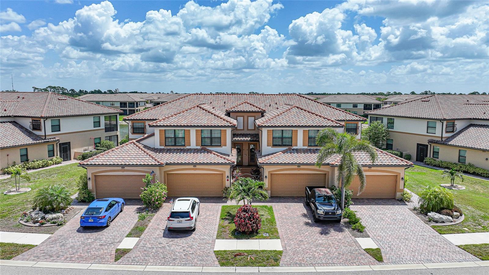 Experience effortless Florida living in this beautifully maintained 3-bedroom, 2-bath coach home with a 2-car garage, located in the highly sought-after, resort-style community of Gran Paradiso. Designed with comfort and functionality in mind, the open-concept layout seamlessly connects the living room, dining area, kitchen, and breakfast nook—creating a cohesive and inviting gathering space. The well-appointed kitchen blends style and practicality, featuring raised panel cabinetry, stainless steel appliances, granite countertops with matching tile backsplash, a convenient breakfast bar and pantry closet. The adjacent breakfast nook is bathed in natural light, while sliding glass doors lead to the lanai, enhancing indoor-outdoor living. High ceilings, clean architectural lines, crown molding and an airy ambiance make this home feel both spacious and welcoming—ideal for hosting or simply relaxing in style. The spacious primary suite offers a private retreat, complete with direct lanai access, dual walk-in closets, and a luxurious ensuite bath. Enjoy an extended dual sink vanity, a soaking garden tub, a walk-in shower, dedicated linen storage, and a private water closet—all thoughtfully designed for comfort and relaxation. Two additional guest bedrooms provide privacy and flexibility for family, visitors, or a home office and share a full bathroom. Step outside to your private, screened-in lanai featuring an added hot tub and tranquil lake views—perfect for morning coffee, evening relaxation, or effortless entertaining while embracing Florida’s serene lifestyle. Residents of Gran Paradiso enjoy an exceptional array of amenities, including a resort-style pool with zero entry, state-of-the-art fitness center, tennis and pickleball courts, scenic walking trails, and a grand Tuscan-inspired clubhouse featuring a spa, sauna, steam room, game rooms, and social spaces. A full-time activities director ensures a vibrant and engaging community lifestyle. Quarterly HOA dues provide true maintenance-free living, covering landscaping, irrigation, pest control, exterior maintenance, plus fiber-optic cable and internet. The CDD is included in the property taxes. Ideally located in Wellen Park’s West Villages District, this home is less than a mile from Downtown Wellen Park, offering dining, boutique shopping, farmers markets, and live entertainment. Nearby attractions include CoolToday Park, Costco, historic downtown Venice, top-rated schools, medical facilities, and some of Southwest Florida’s most beautiful beaches. Whether you’re seeking a full-time residence, seasonal getaway, or investment property, this exceptional first-floor coach home delivers on every level.
**PLEASE ENJOY THE 3D INTERACTIVE VIRTUAL TOUR ASSOCIATED WITH THIS LISTING**