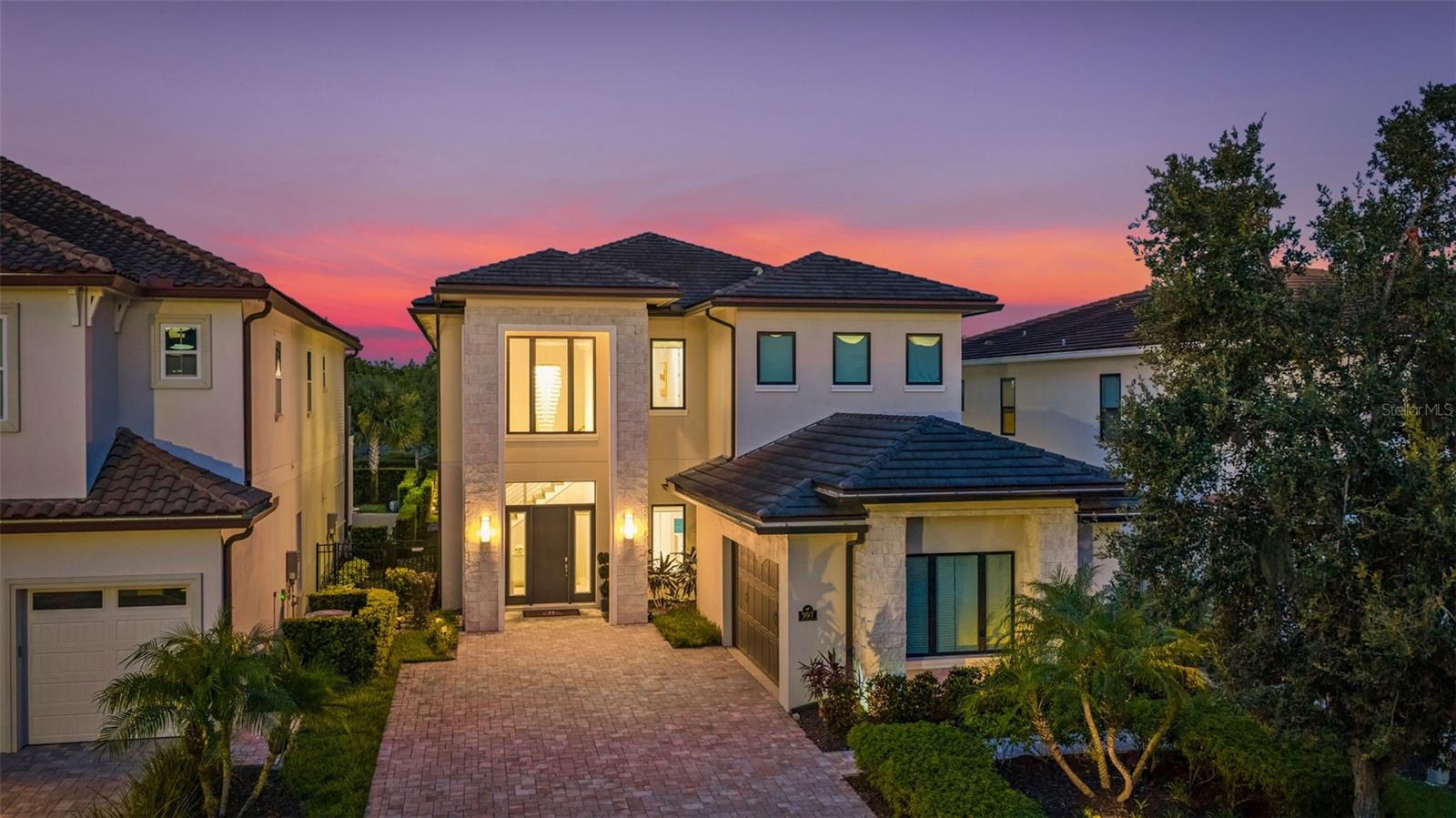 From the moment you step through the doors of this SPECTACULAR home you will realize you have found VACATION LUXURY at its finest. Welcome to Nicklaus Manor at Reunion located in the exclusive Bear's Den community at Reunion Resort. This well appointed and meticulously kept 6 Bedroom, 6 Full Bath En suite, and 3 half bath home, is being offered TURN KEY. The Santa Barbara Model boasts high end finishes throughout with an open floor plan that consists of a first floor primary bedroom that includes a HUGE custom walk-in owner's closet with the ability to lock off for privacy as well as additional closet for guests, dual sinks, a large walk-in shower and soaking tub. There is an 2nd en suite guest bedroom on the first floor. The spacious chef's kitchen includes a large island with seating for 4 ppl., an abundance of hardwood cabinets with crown moulding, quartz countertops, stainless JENN-AIR appliances that include a Gas Range, two refrigerators, two dishwashers, convection oven and more. Enjoy quiet meals in the formal dining area with seating for 10 ppl. Adjacent to the dining area is a spacious wet bar area with wine racks, two beverage coolers and additional cabinets for your convenience. Recent enhancements to the home include a converted garage to a state of the art Golf Simulator, two professionally themed children's rooms, decorative accent walls and decor were added throughout the home, and updated movie theater with gaming consoles. The expansive loft area has additional seating, air hockey, pool table, classic arcade game console and a beverage cooler, making this space ideal for both kids and adults to enjoy hours of entertainment. Step outside the loft area to a spacious covered lanai complete with new patio furniture, shuffleboard and an amazing views of the pool deck and the Bear's Den residents only park. The two remaining bedrooms one being an additional primary suite that offers private access to a covered lanai on the second floor. As you step outside to an island oasis enjoy countless hours of enjoyment on your amazing pool deck, featuring a covered lanai with ample seating for family & guests, a lagoon style pool, jacuzzi and beautiful water feature. There is a summer kitchen with a decorative tile backsplash, and a pool half bath just off the lanai. This amazing home is a great opportunity for a vacation rental, second home or primary residence and is walking distance to the Jack Nicklaus clubhouse where the Traditions restaurant and bar is located as well as the Jack Nicklaus Pro Shop. The Bear's Den community features gated security within the gates of Reunion, a fantastic dog park that you can access from your back gate on you pool deck, a sand volleyball court and putting green to practice your game.  Reunion Resort is a one of a kind 2300 acre Resort and Golf community that has many amenities including a water park complete with water slides, lazy river, zero entry pools & food and beverage service, 3 award-winning golf courses designed by the legends of golf (Palmer, Watson & Nicklaus), 11 pools throughout the community, mini putt putt golf, world class tennis courts, pickleball courts, playgrounds, dog parks, golf cart & bike rentals and several on-site restaurants to include fine dining. Reunion Resort is located just 6 miles to Disney and the parks, and a short drive to the Orlando International Airport. ACTIVE TRANSFERABLE MEMBERSHIP for the next owner. Future rental income and bookings can convey.