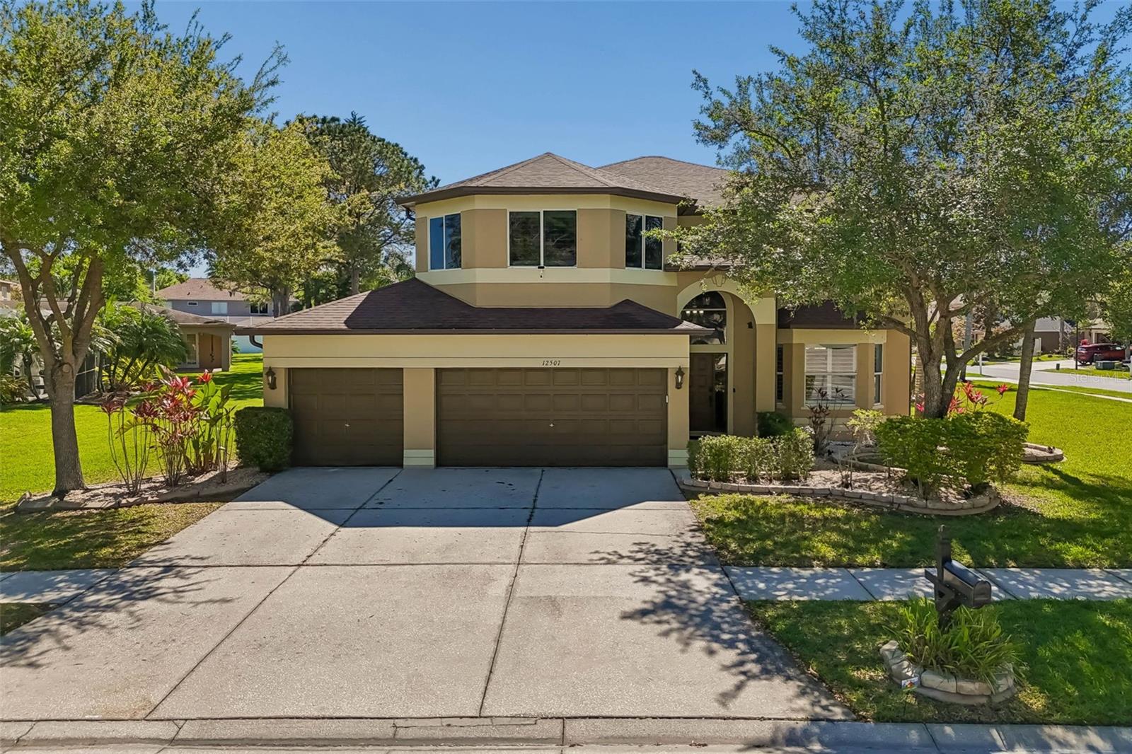 Welcome to this exceptional two-story home located in a highly desirable gated golf course community, The Eagles complete with charming sidewalks and a beautifully maintained streetscape. Offering the perfect blend of luxury, functionality, and peace of mind, this spacious residence features six bedrooms and three full bathrooms, ideal for growing families or those who love to entertain. Step inside to a grand two-story entryway and enjoy real wood flooring that adds warmth and elegance throughout the main living areas. The home is thoughtfully upgraded Kitchen with custom soft-close cabinetry and drawers, granite countertops, and a well-appointed kitchen featuring premium Bosch appliances—including a built-in oven, cooktop, refrigerator, and beverage fridge—perfect for any home chef. The open-concept design flows seamlessly to the outdoor living space through expansive glass sliders, leading to a covered patio and a fully fenced backyard. Enjoy year-round relaxation in your private saltwater pool with an electric heater and new (26) pool pump, making it an ideal setting for entertaining or unwinding in your own oasis. Additional highlights include updated bathrooms, shutters throughout, a double sink in the kitchen, and major system upgrades for peace of mind—including a 2026 hot water heater, dual AC units (26). sprinkler system, French drain , and full gutter system surrounding the home. This is a rare opportunity to own a move-in-ready home in a sought-after community that offers both luxury and lifestyle. Schedule your private showing today