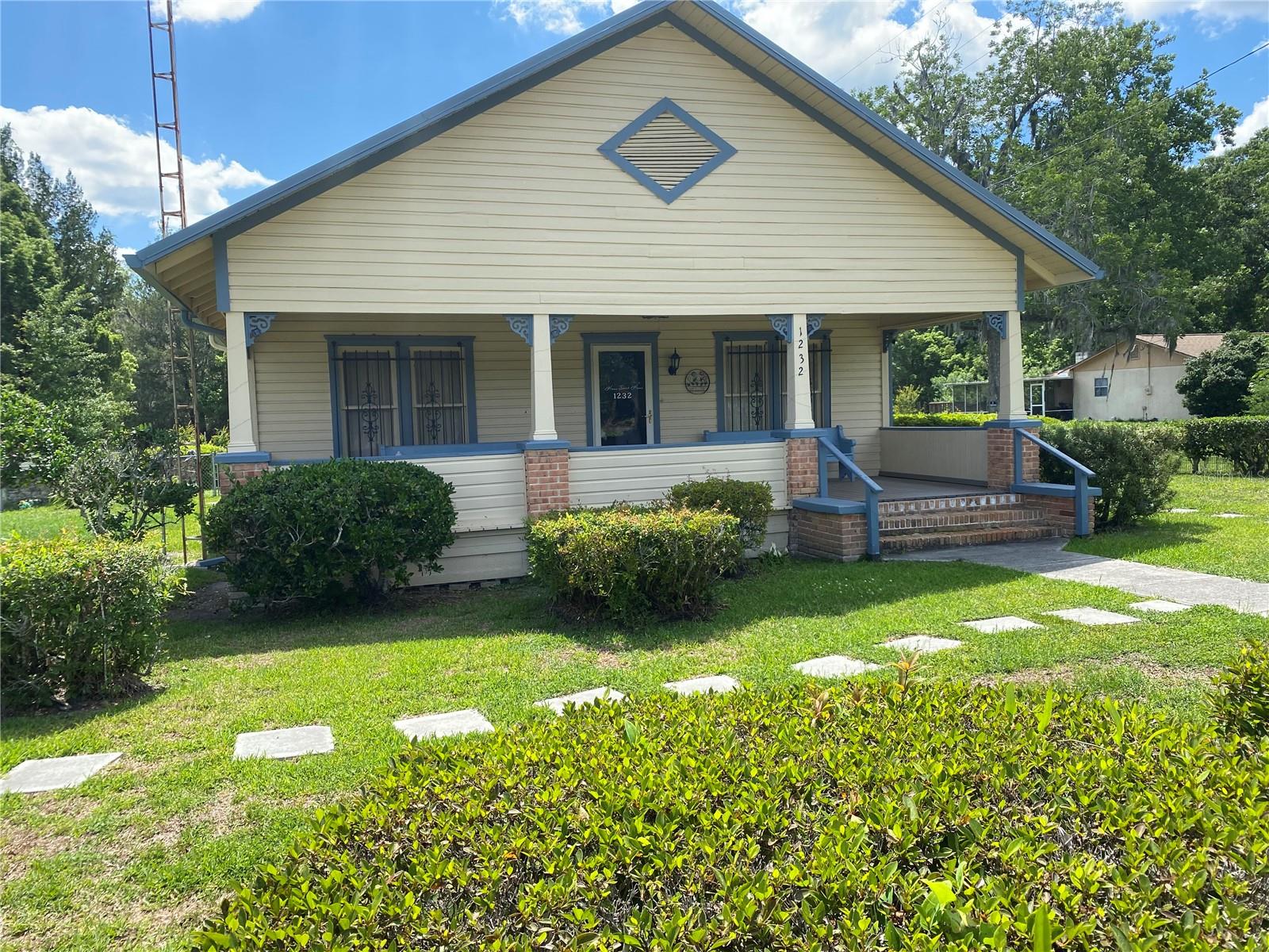 Wonderful home on 1+ acre. 3-bedroom 2 bath with 1,300 square feet of living space. On a paved road. This home has been painted inside and out with a recently placed seamless gutter. Separate metal garage is two years old, and it also has a storage shed. It is well landscaped. A large covered front porch that is perfect to start or end your day. A screened back porch along with solid wooden deck. The back yard is fenced. This very well-maintained home is waiting for you.