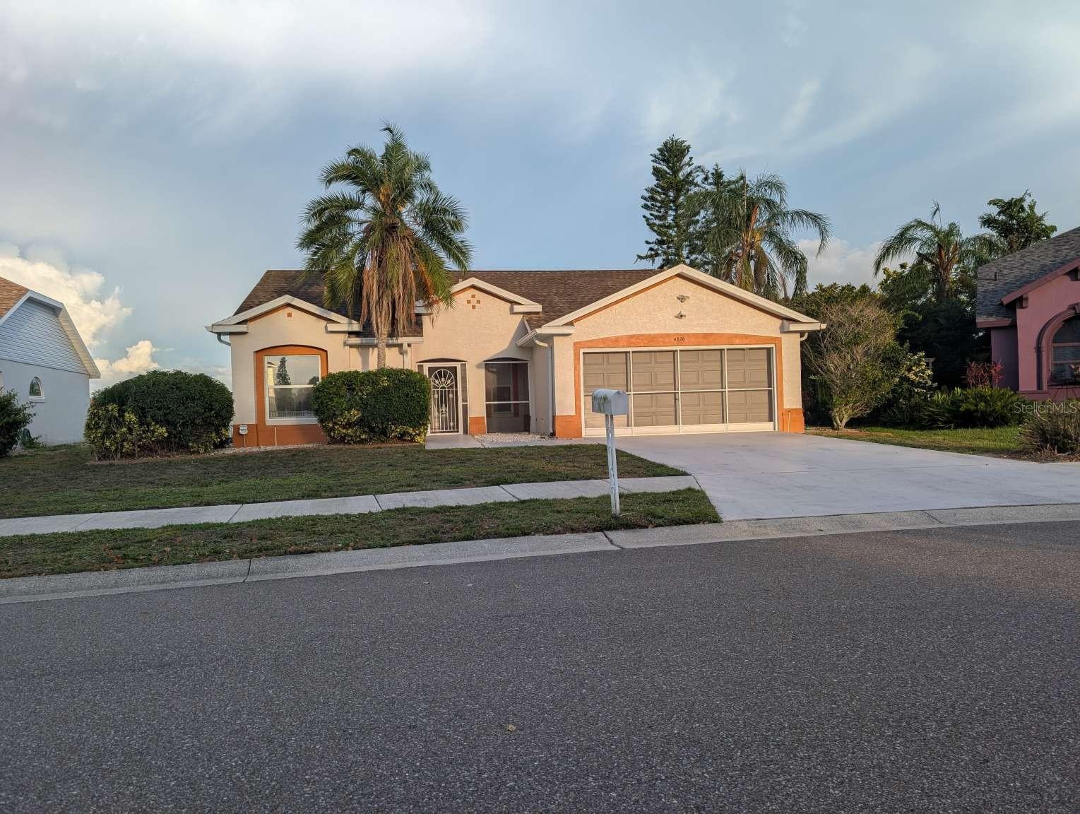 Welcome to a private Florida retreat. This updated 3-bedroom, 2-bath pool home combines modern upgrades, peaceful surroundings, and exceptional outdoor living. Set on a quiet circle drive at the rear of Braden River Lakes with minimal through traffic, the home features new flooring throughout, custom trim work, fresh interior and exterior paint, a new HVAC system with a 10-year limited warranty, new bathroom vanities and faucets, and a renovated kitchen with new cabinetry, oversized granite countertops, new sink and disposal, and stainless steel appliances including an induction range, microwave, dishwasher, and refrigerator. The interior flows to a large screened pool and southeast-facing lanai overlooking a tranquil lake. The fenced backyard offers space for outdoor enjoyment. Additional features include an integrated expandable SimpliSafe security system, a new pool pump, and a screened 2-car garage with storage or workshop potential. Braden River Lakes amenities include a community pool, tennis and pickleball courts, sand volleyball, playground, gazebo, and barbecue facilities. Convenient to shopping, dining, schools, medical facilities, and Gulf Coast beaches.