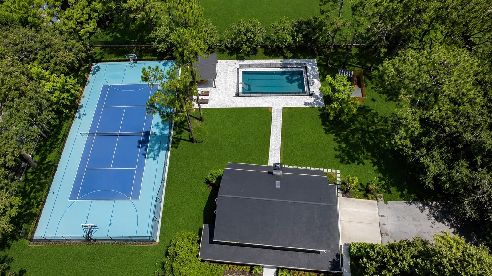 Experience the perfect blend of luxury, privacy, and recreation in this beautifully renovated farmhouse estate situated on 1.33 acres in the heart of Lake Nona. Tucked behind a private driveway and surrounded by lush grounds, this exceptional 4-bedroom, 2.5-bath residence offers a rare opportunity to enjoy resort-style living just minutes from the area's premier amenities. Designed with timeless farmhouse charm and modern elegance, the home features spacious living areas, designer finishes, and inviting front and rear covered porches perfect for enjoying Florida's beautiful weather. The thoughtfully updated interior combines warmth, sophistication, and functionality, creating an ideal setting for both everyday living and entertaining. Step outside to your own private retreat featuring a heated saltwater pool and spa, fully equipped outdoor kitchen, expansive outdoor living spaces, and a private storage shed. Sports enthusiasts will appreciate the dedicated tennis and basketball court, making this property a true recreational paradise. Located near the renowned United States Tennis Association National Campus, this home is a dream for tennis enthusiasts seeking luxury accommodations close to world-class facilities and training opportunities. Offering unmatched privacy, upscale amenities, and a prime Lake Nona location, this extraordinary estate delivers a lifestyle rarely available in the rental market. Additional Features:
1.33-acre private homesite,
Fully renovated luxury farmhouse,
4 Bedrooms | 2.5 Bathrooms,
Front and rear covered porches,
Heated saltwater pool and spa,
Outdoor kitchen,
Private tennis and basketball court,
Private driveway, Storage shed. Minutes from Lake Nona Town Center, Medical City, Orlando International Airport, and the USTA National Campus. Security deposit is fully refundable upon lease completion, provided the property is returned in substantially the same condition as received, normal wear and tear excepted. Rare opportunity to lease one of Lake Nona's most unique lifestyle properties—where luxury, recreation, and privacy meet.