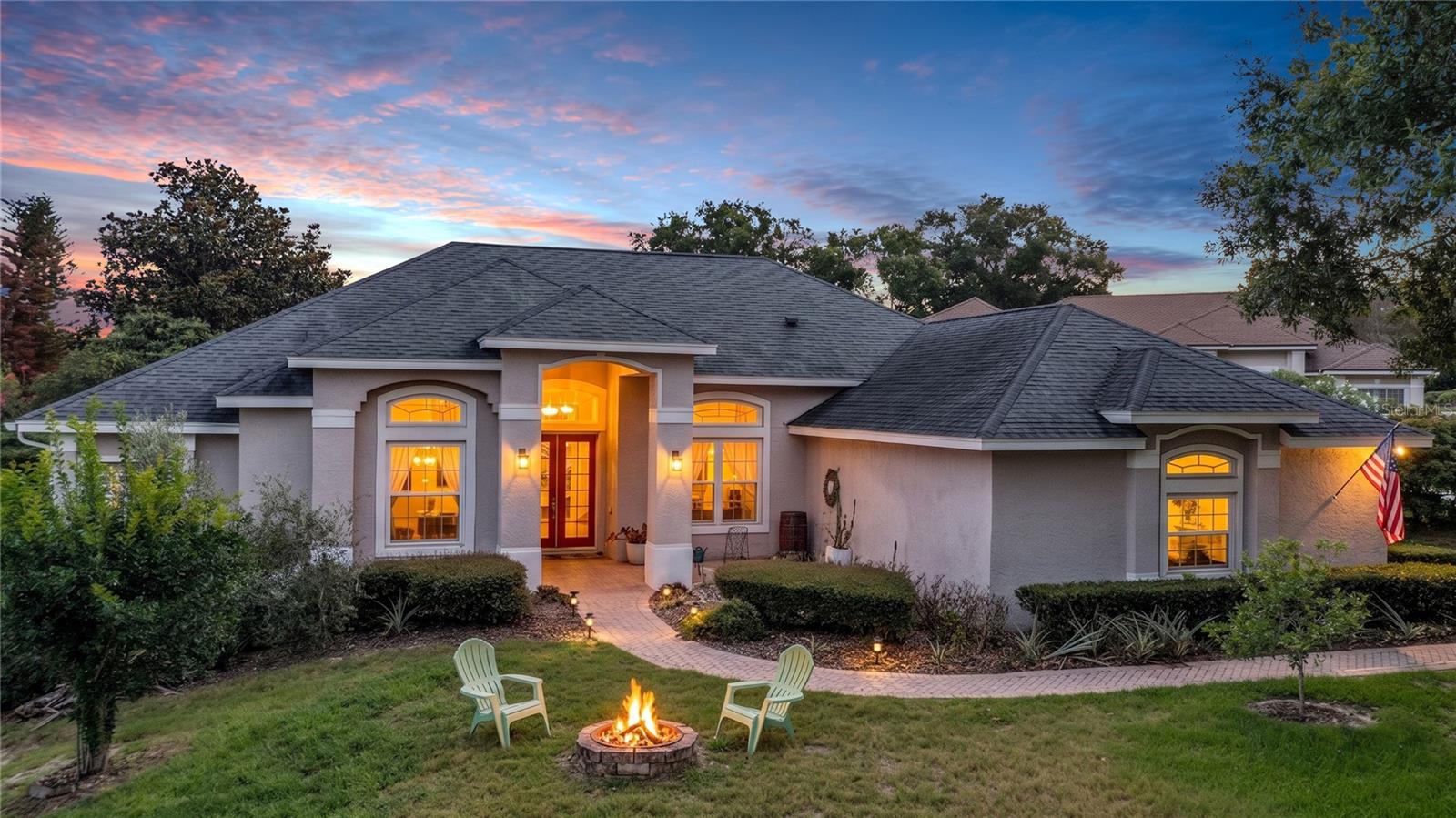 Set in desirable North Bay in the heart of Dr. Phillips/Bay Hill, this 5 bed, 3 bath pool home offers 2,872 sq ft on a 0.49-acre cul-de-sac lot with a 3-car garage, tall ceilings, and a 3-way split plan designed for privacy and flexibility. The kitchen offers plenty of counter space, newer appliances, granite counters, 42" cabinets with crown molding and hardware, under-cabinet lighting, tile backsplash, breakfast bar and pantry. The family room features built-ins for the entertainment center and new flooring, and the formal living room includes a bookcase with a rolling ladder. The owner’s suite is set apart on its own side of the home with 2 walk-in closets and an en-suite bath featuring 2 vanities, a glass-enclosed shower, separate soaking tub and private water closet. One guest bedroom has a bath just outside the door with a single vanity and tub/shower combo, while the two other guest bedrooms share the pool bath with a single vanity and shower. The office/5th bedroom includes a Murphy bed. Recent updates include paid-off solar panels, roof replaced (2019), Low-E doors and windows (2020 & 2021), new AC with ultra air filtration (2023), added attic insulation, insulated garage doors, full re-plumb, whole-house water filtration, reverse osmosis, a dedicated tankless water heater for the primary bath tub, expanded garage electrical, and a Level 2 EV charger. The large front yard is anchored by a huge oak tree with a swing, while the fenced backyard offers saltwater pool filtration, exterior lighting, an exterior bar and grill, and edible landscaping with lime, lemon, orange, grapefruit, mango, persimmon, fig, guava, nectarine, avocado, and pineapple plantings. Positioned in one of Orlando’s most sought-after areas near Bay Hill Club & Lodge, the Butler Chain of Lakes, Sand Lake Road’s Restaurant Row, Trader Joe’s, The Fresh Market, Universal Orlando Resort, and the Orange County Convention Center, this home brings together pool living, EV readiness, solar efficiency, water filtration, fruit trees, and a central Dr. Phillips location.