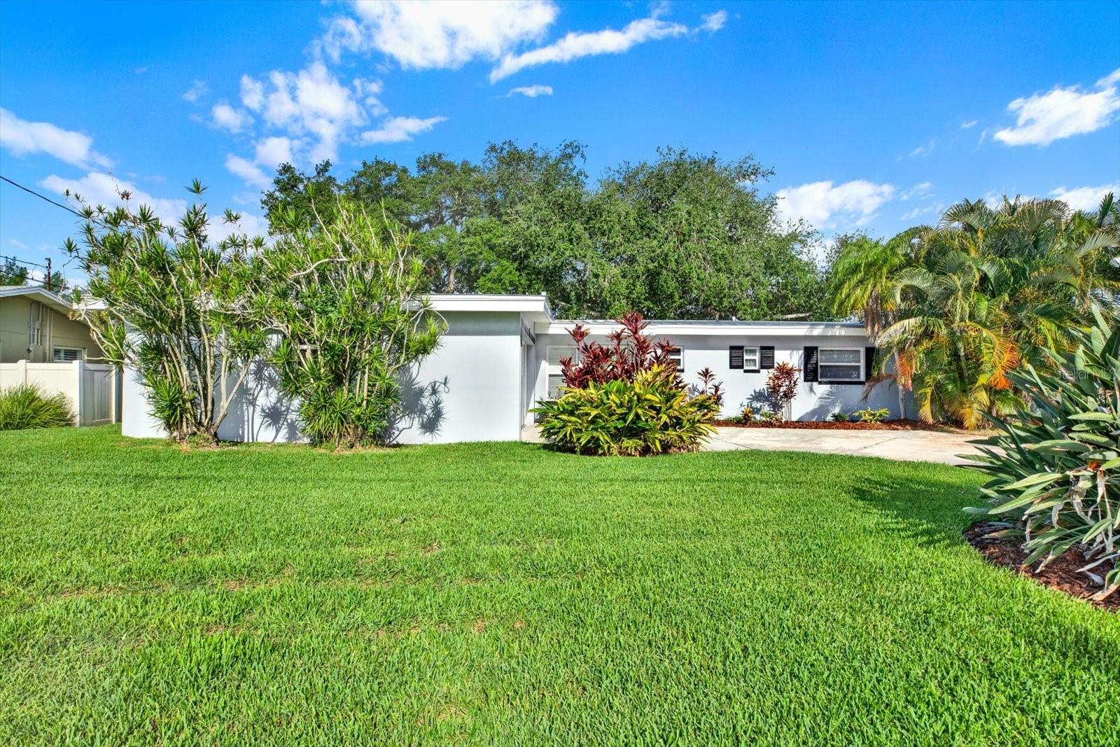 Virtually Staged. Discover the potential of this waterfront home in one of St. Petersburg's most established waterfront neighborhoods. Situated on a deep-water canal with direct access to Tampa Bay, this property features a private dock and plenty of room to add a boat lift for the ultimate Florida lifestyle.

Built in 1959, the home offers the perfect blend of original character and everyday comfort. Inside, you'll find beautiful original terrazzo floors throughout much of the home, a spacious and functional layout, and a large Florida room with sliding glass doors that open to an expansive patio overlooking the lush backyard. The primary suite includes a walk-in closet and en-suite bathroom, while the attached two-car garage provides ample storage for vehicles, tools, and water toys.

The beautifully landscaped front and back yards feature mature trees, irrigation, and plenty of space to relax, entertain, or create your own private outdoor oasis. Whether you're looking to move right in and enjoy the home as it is or enhance its mid-century charm with your own personal touches, this property offers endless possibilities.

Recent improvements provide peace of mind, including a 2023 metal roof with warranty, 2024 HVAC system, 2019 electrical panel, newer stainless-steel appliances, fresh interior and exterior paint, a new water heater, private dock built in 2013, and seawall replaced in 2016.

Ideally located just minutes from vibrant downtown St. Petersburg, waterfront parks, top-rated restaurants, shopping, Shore Acres Elementary, Northeast High School, and the new Speer YMCA, you'll also enjoy easy access to Tampa International Airport, award-winning Gulf beaches, and all the dining, arts, and entertainment that make St. Pete one of Florida's most desirable places to live.