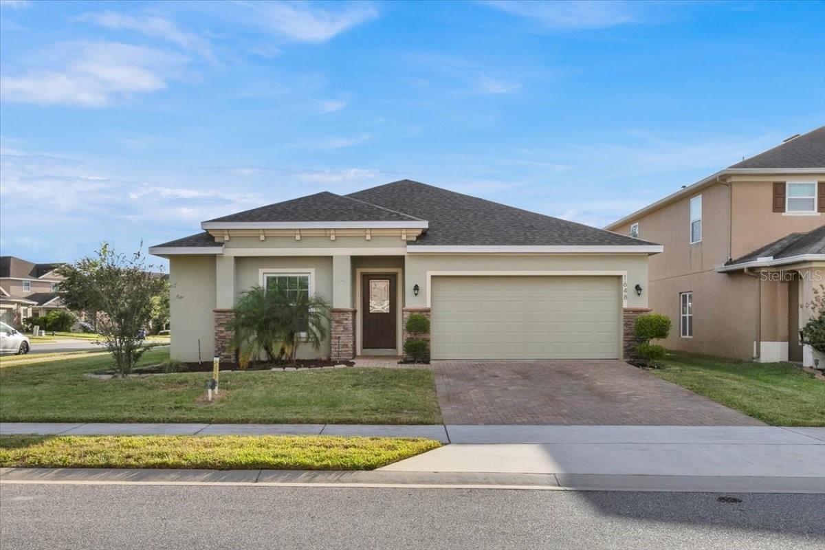 ***RECENT PRICE DROP!*** Beautiful 3/2 corner-lot home nestled in the family-friendly community of Ardmore Reserve. Built in 2016, this home features an open floor plan. A separate den/office space could be converted into a fourth bedroom. The functional kitchen features stainless steel appliances (refrigerator, stove, dishwasher, and microwave), granite countertops, a breakfast bar, beautiful wood counter-height dining table, pantry, and 42 inch cabinets with crown molding. Ceramic tile throughout the living space and bathrooms with carpet in the three bedrooms. The master suite includes a spacious walk-in closet and bath with dual sinks, garden tub and separate shower. Blinds and ceiling fans included throughout. Large inside laundry/utility room includes washer/dryer and a small pet door leading into the garage. Sliding glass doors open up to the fenced-in backyard and 10x12 screened-in lanai. There is even a fire pit in the backyard! Owners of this home will also have access to the community pool and play ground adjacent to the home! This property is centrally located near the Turnpike entrance going into Orlando and not far from the airport, theme parks, and several local farmer's markets. Don't miss your chance on this lovely home!
