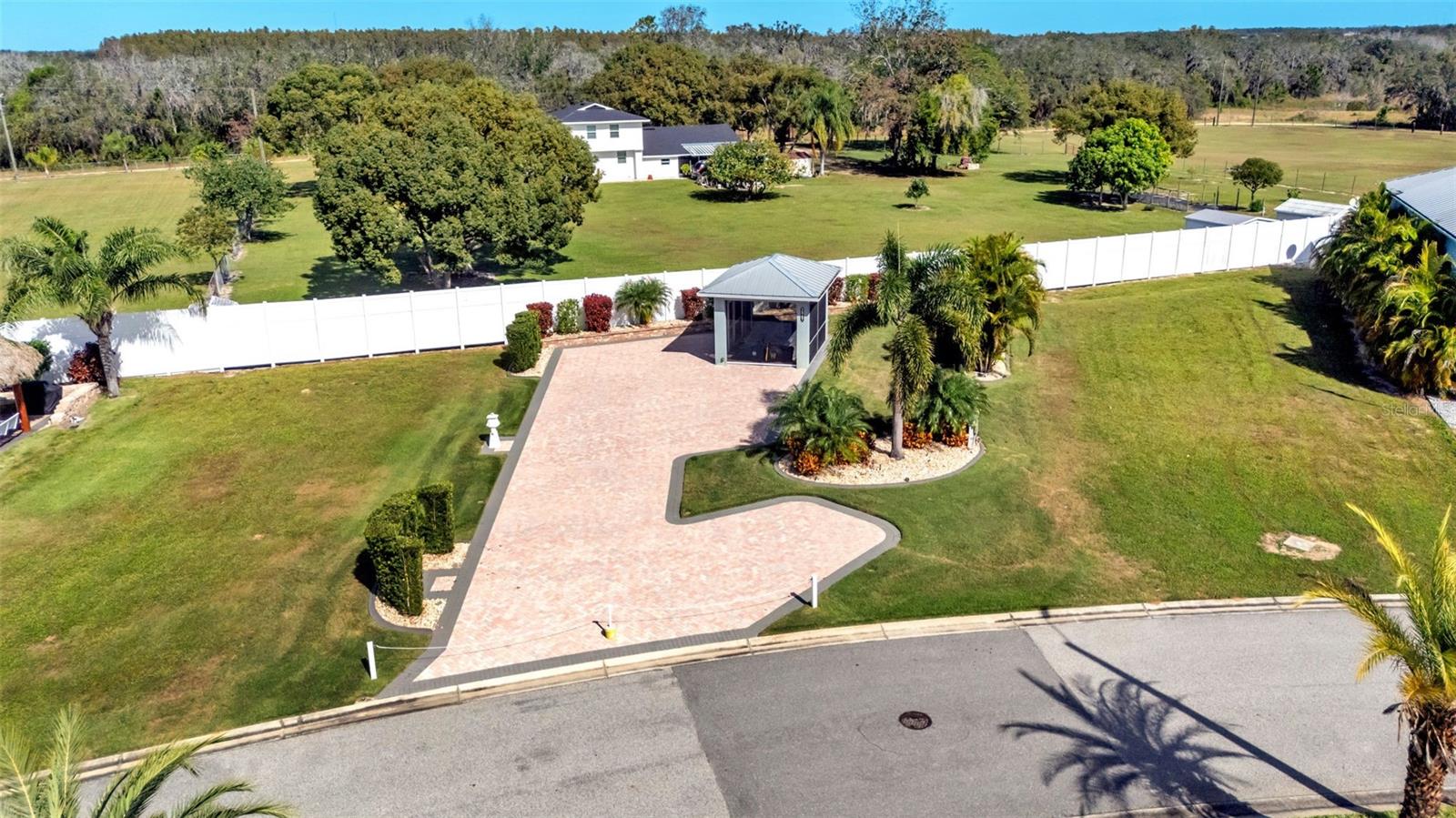 This gorgeous, oversized paver pad is the perfect place to park your motorcoach and start enjoying the resort lifestyle. The property features a beautiful, custom-built screened pavilion, offering the ideal bug-free space for outdoor dining, entertaining, or simply relaxing with a view. The lot includes mature landscaping providing privacy and a tropical feel. This is a must-see property, ready for you to move in!

Featuring: Oversized Paver Pad, Custom Screened Pavilion, Mature Landscaping, Great Location!

Bay Lake Motorcoach Resort is a Class A motorcoach resort offering incredible amenities. Owners and visitors can fill their days with activities and club outings or simply relax and enjoy the resort. Whether in search of community, travel, relaxation or recreation, Bay Lake is your home base for the Florida Lifestyle.